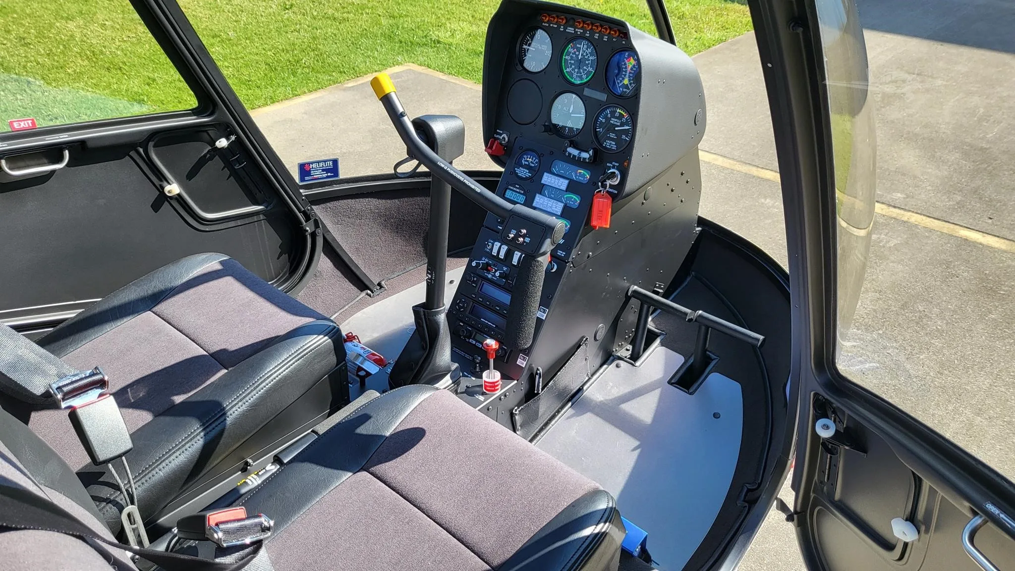 Cockpit and instrument panel of a 2027 ROBINSON R22 BETA II.
