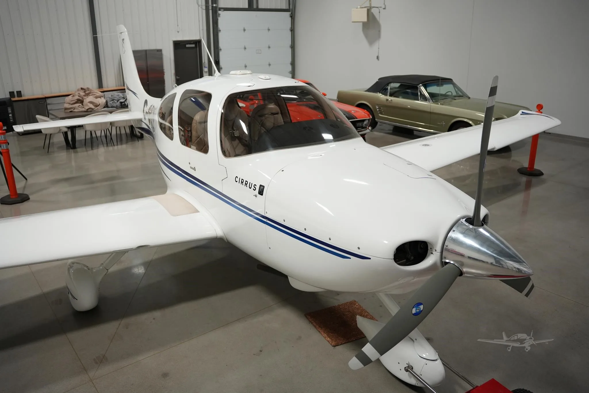 Exterior view of a 2003 CIRRUS SR20, C-GGDS.