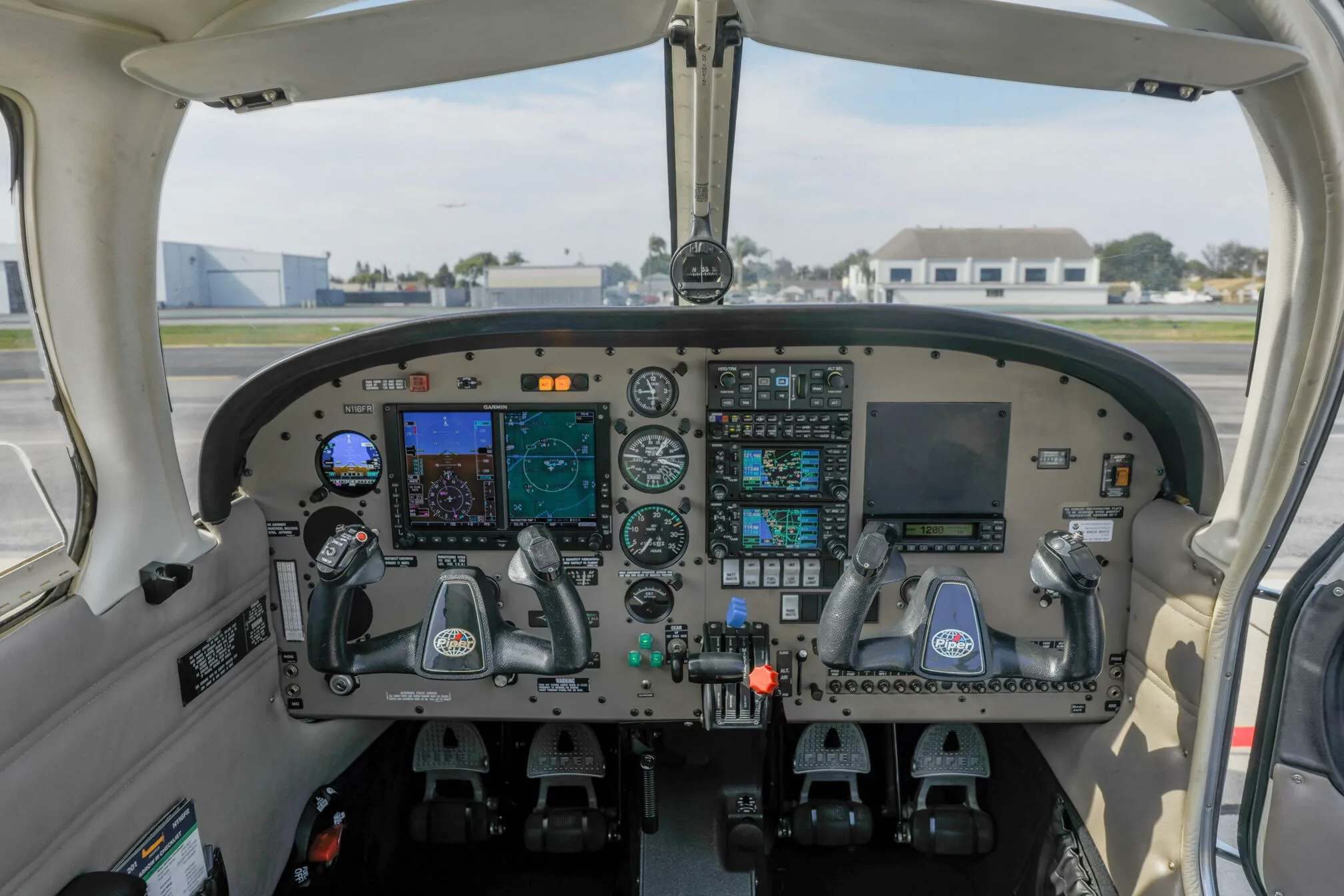 Cockpit and instrument panel of a 2014 Piper Arrow III.
