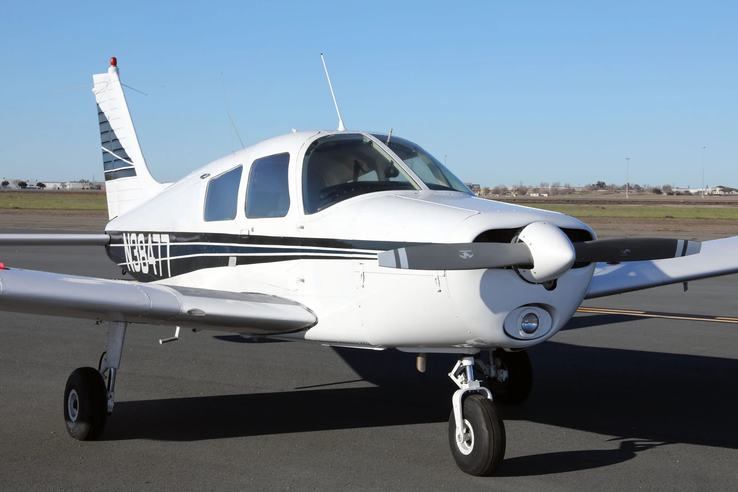Exterior view of a 1977 Piper Cherokee 140, N38477.