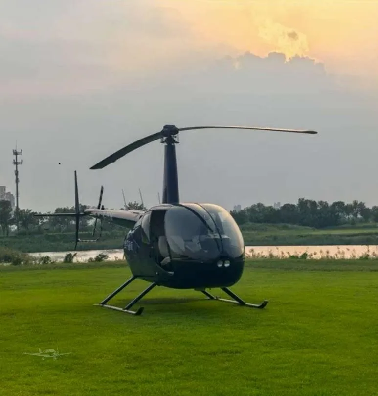 Exterior view of a 2013 ROBINSON R44 RAVEN I.