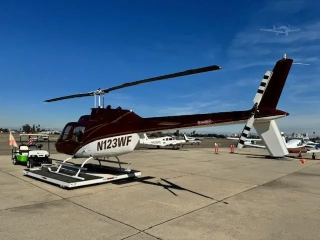 Exterior view of a 1980 BELL 206B III, N123WF.