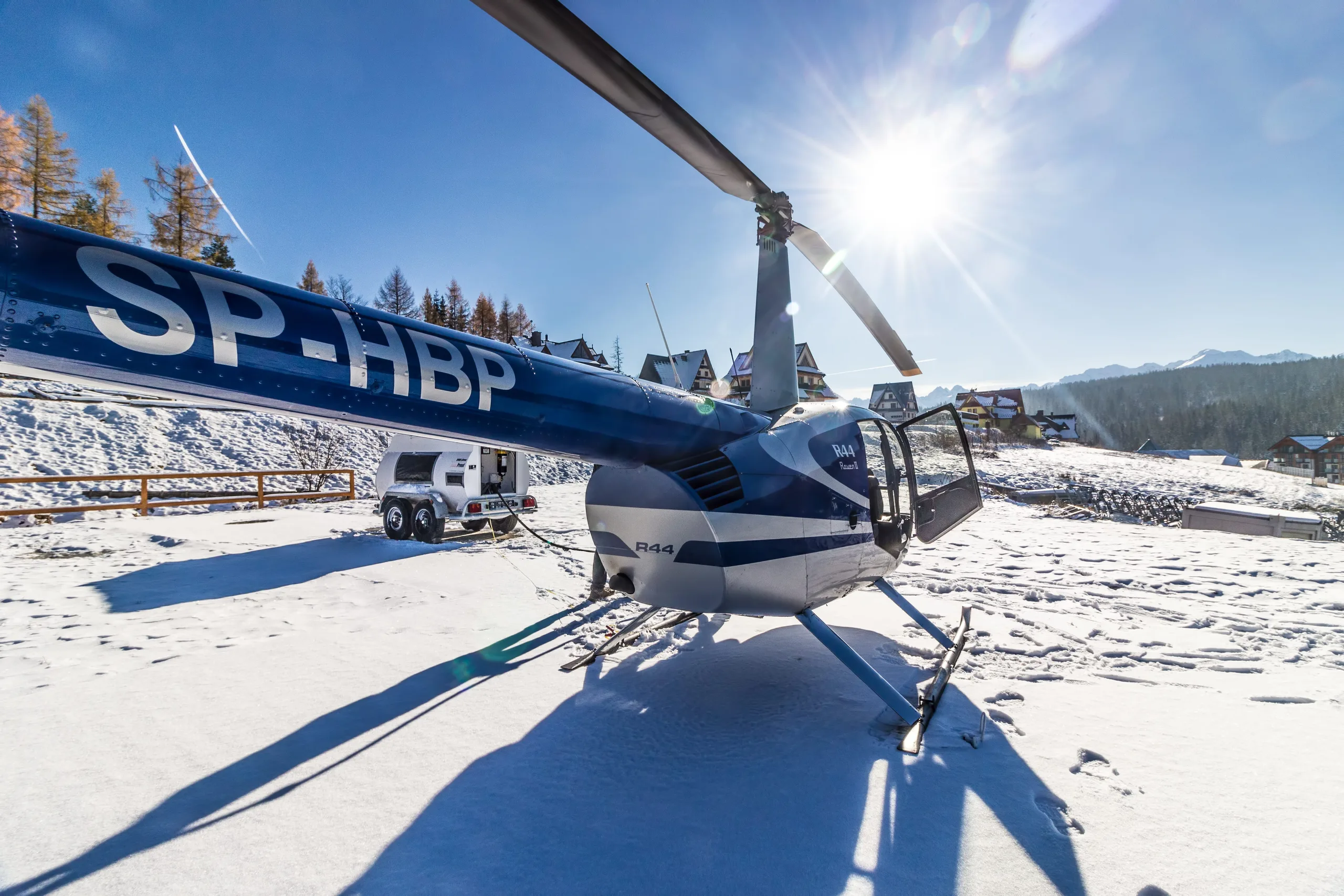 Exterior view of a Robinson R66, SP-GSS.