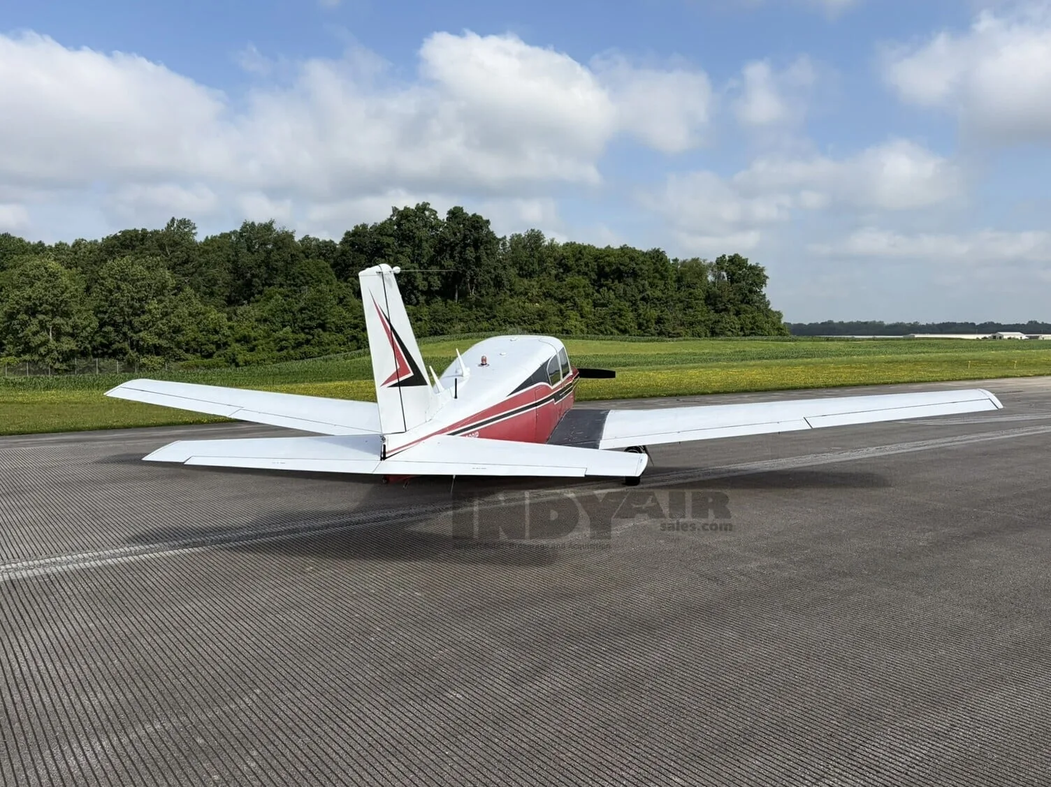 Exterior view of a Piper Comanche 250, N8381P.