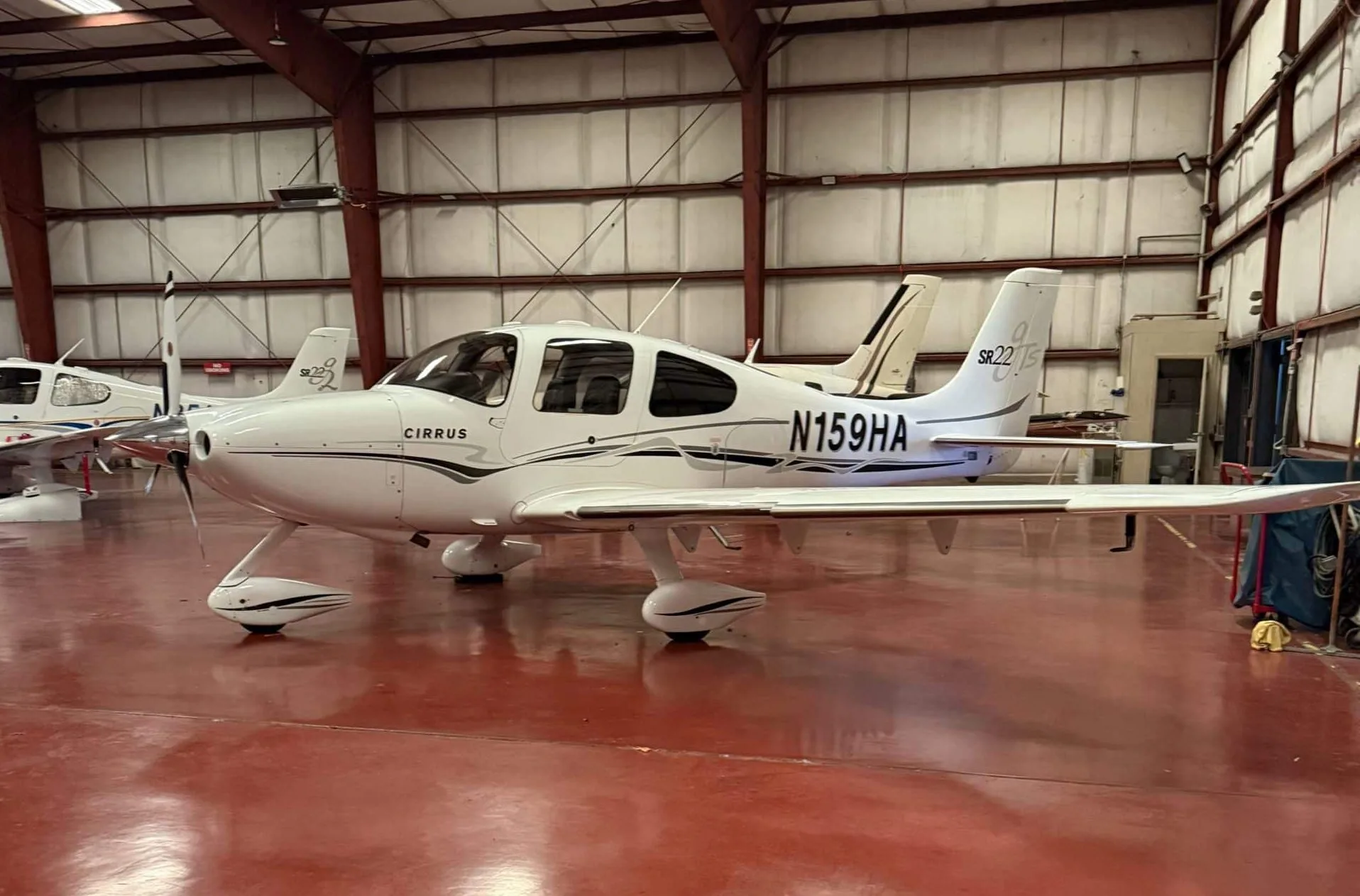 Exterior view of a 2014 Cirrus SR22T G5 GTS, N308AW.