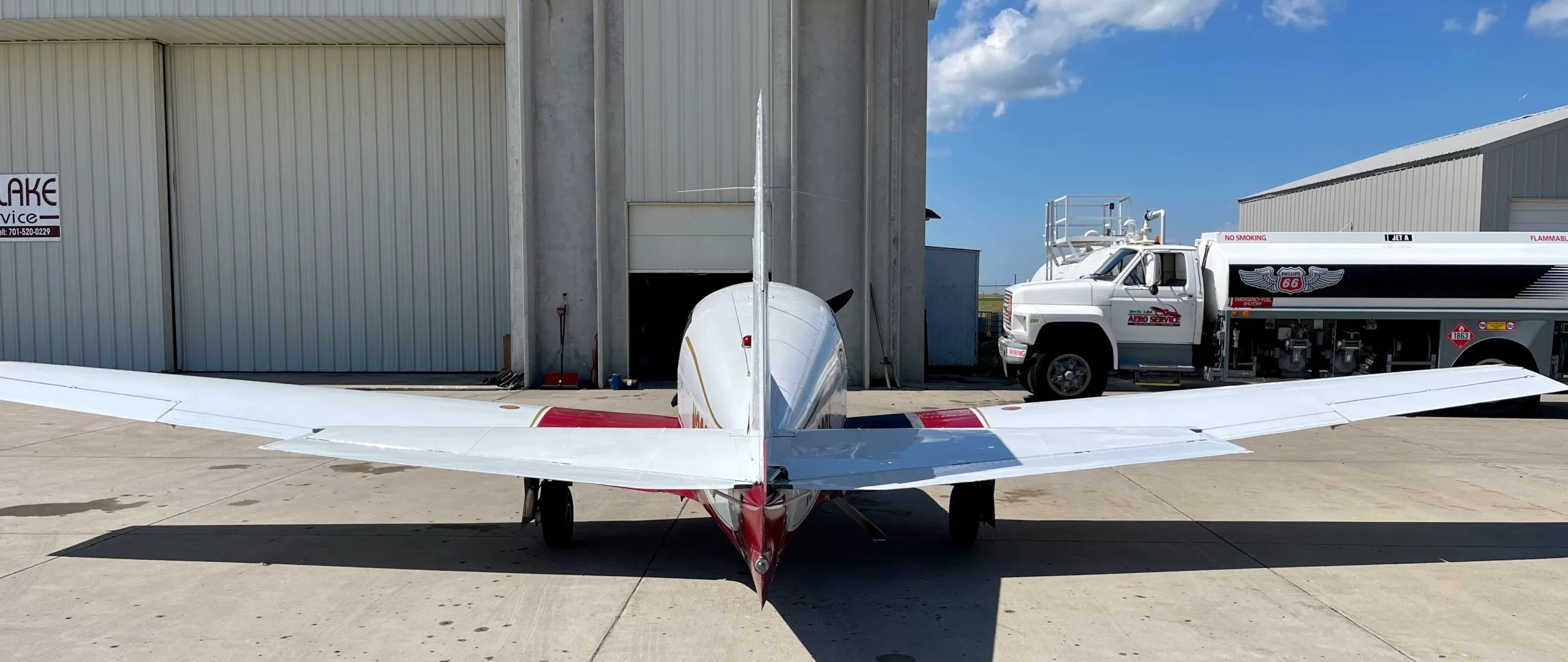 Exterior view of a 1967 Mooney M20C, N3203F.