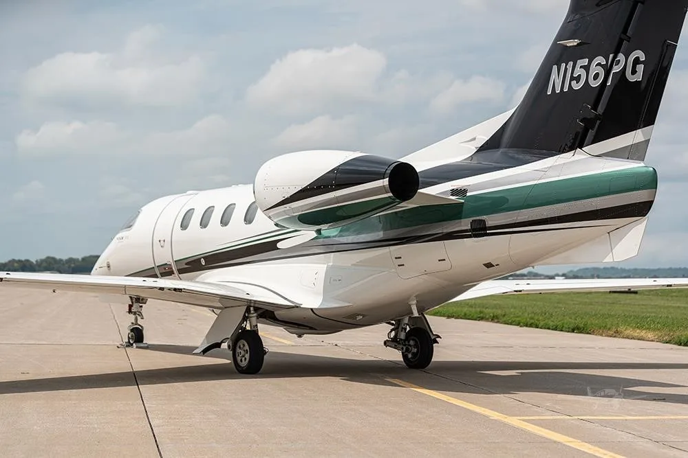 Exterior view of a 2018 EMBRAER PHENOM 300E, N156PG.