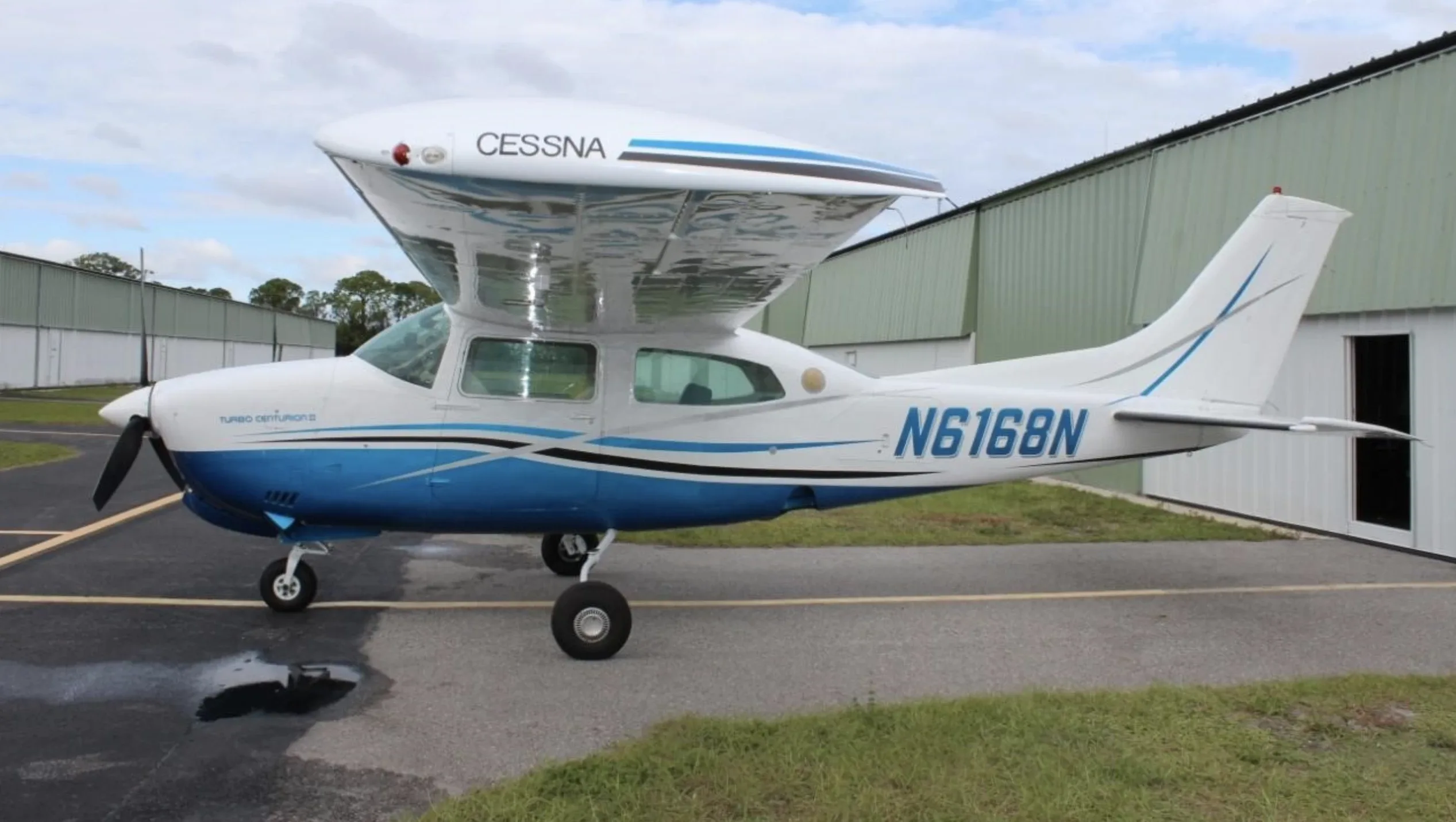 Exterior view of a Cessna Piston 180, N9206C.