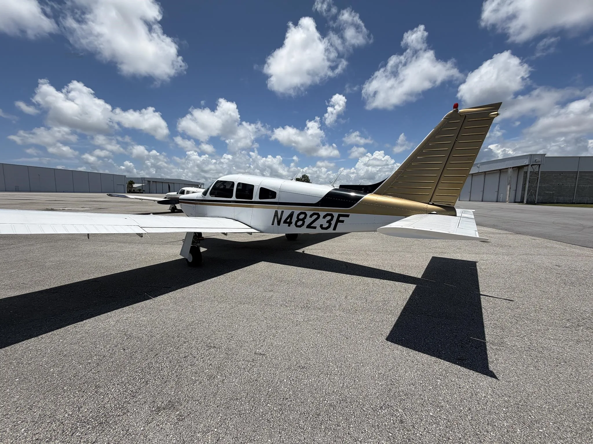 Exterior view of a 1976 PIPER ARROW II, N4823F.