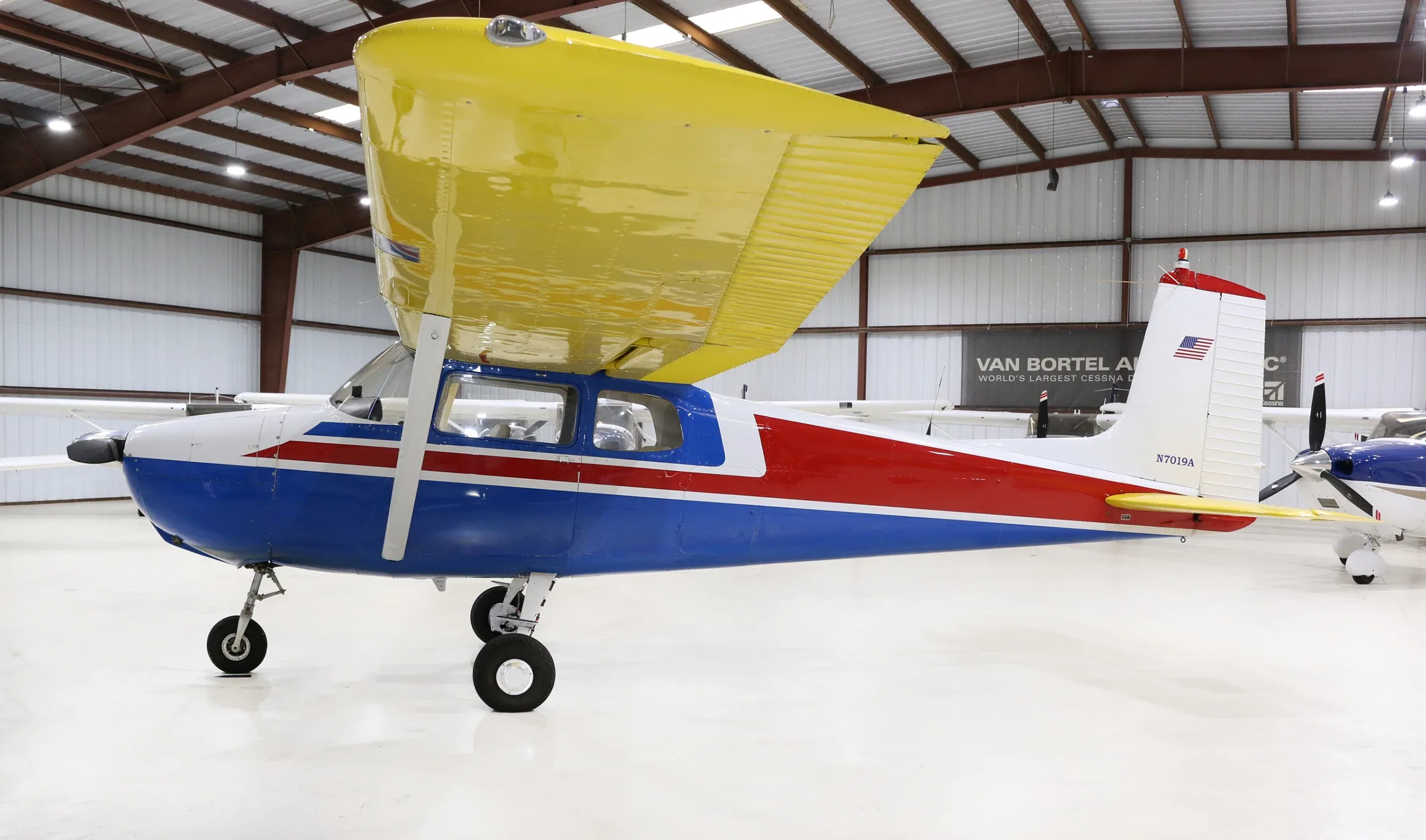 Exterior view of a Cessna Piston 180, N9206C.