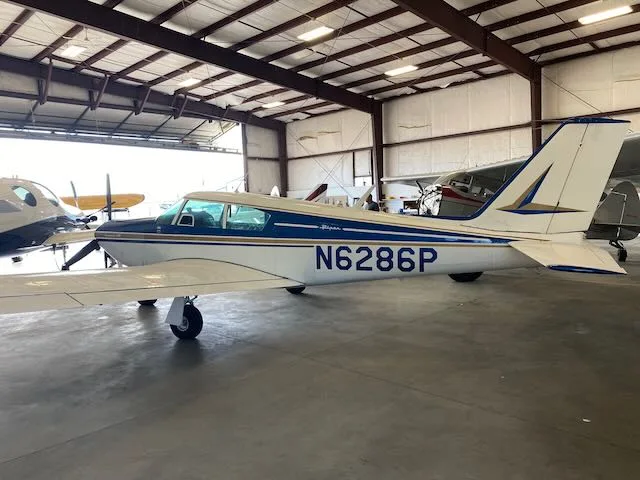 Exterior view of a 1959 Piper Comanche PA24-250, N6286P.
