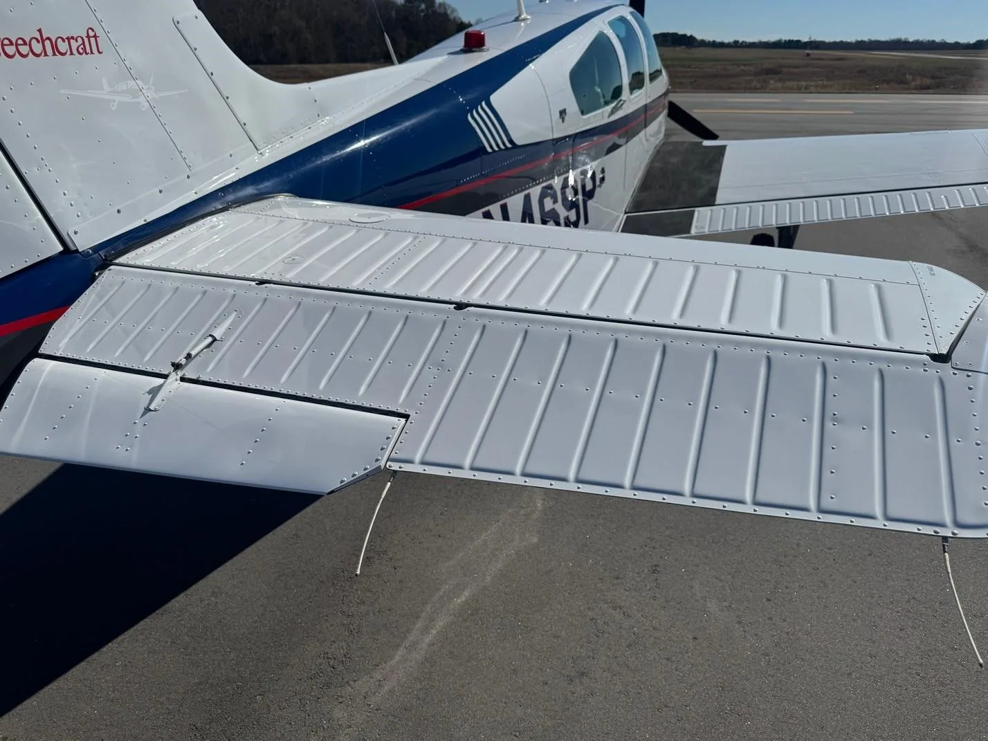 Exterior view of a 1994 BEECHCRAFT F33A BONANZA, N469P.