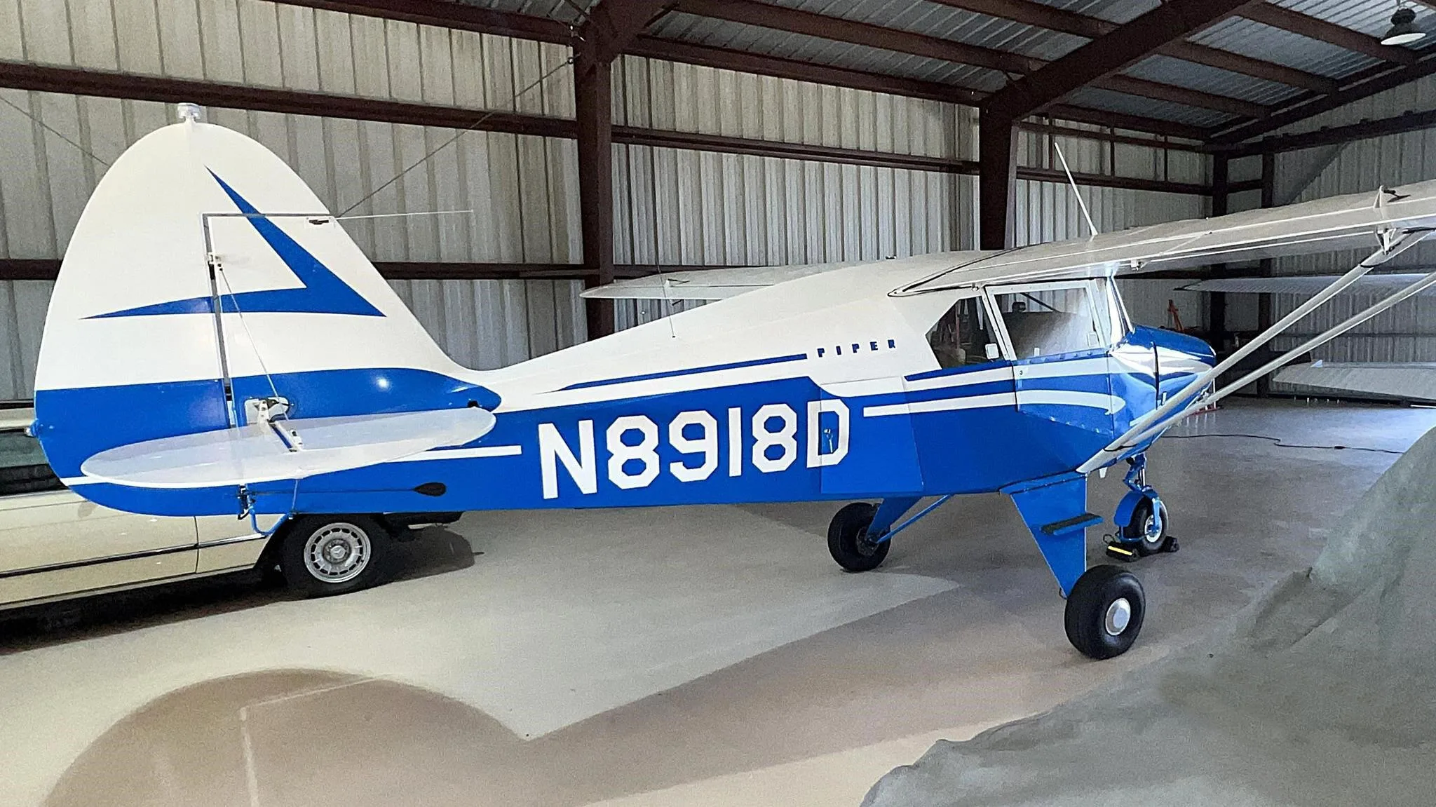 Exterior view of a 1958 Piper PA-22-160 Tri-Pacer.