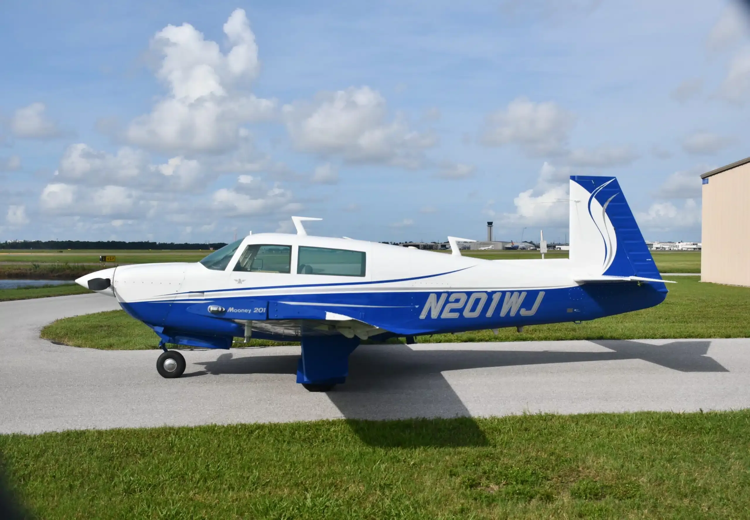 Exterior view of a 1996 Mooney M20J MSE, N2RH.