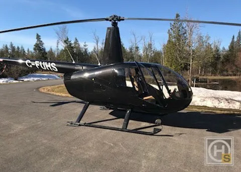 Exterior view of a 2013 Robinson R44 RAVEN II, C-FUHS.