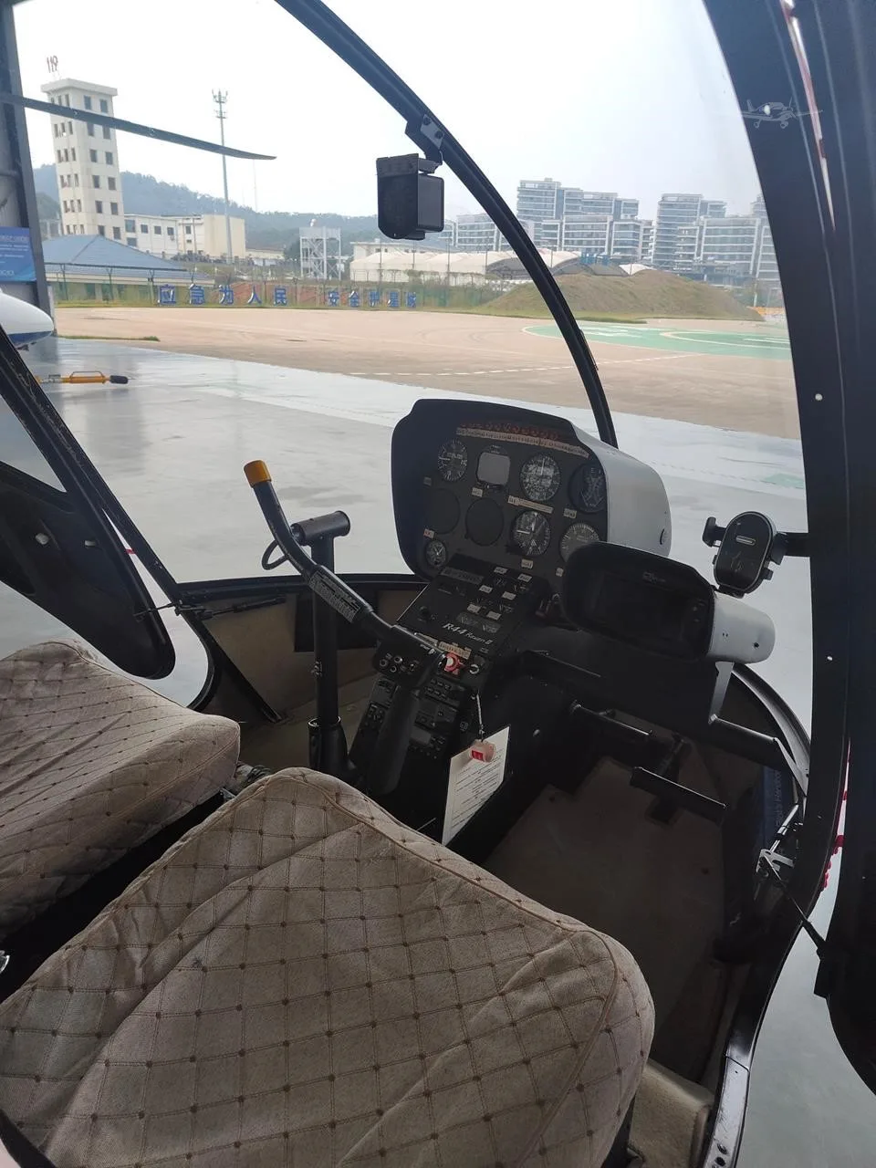 Cockpit and instrument panel of a 2015 ROBINSON R44 RAVEN II.