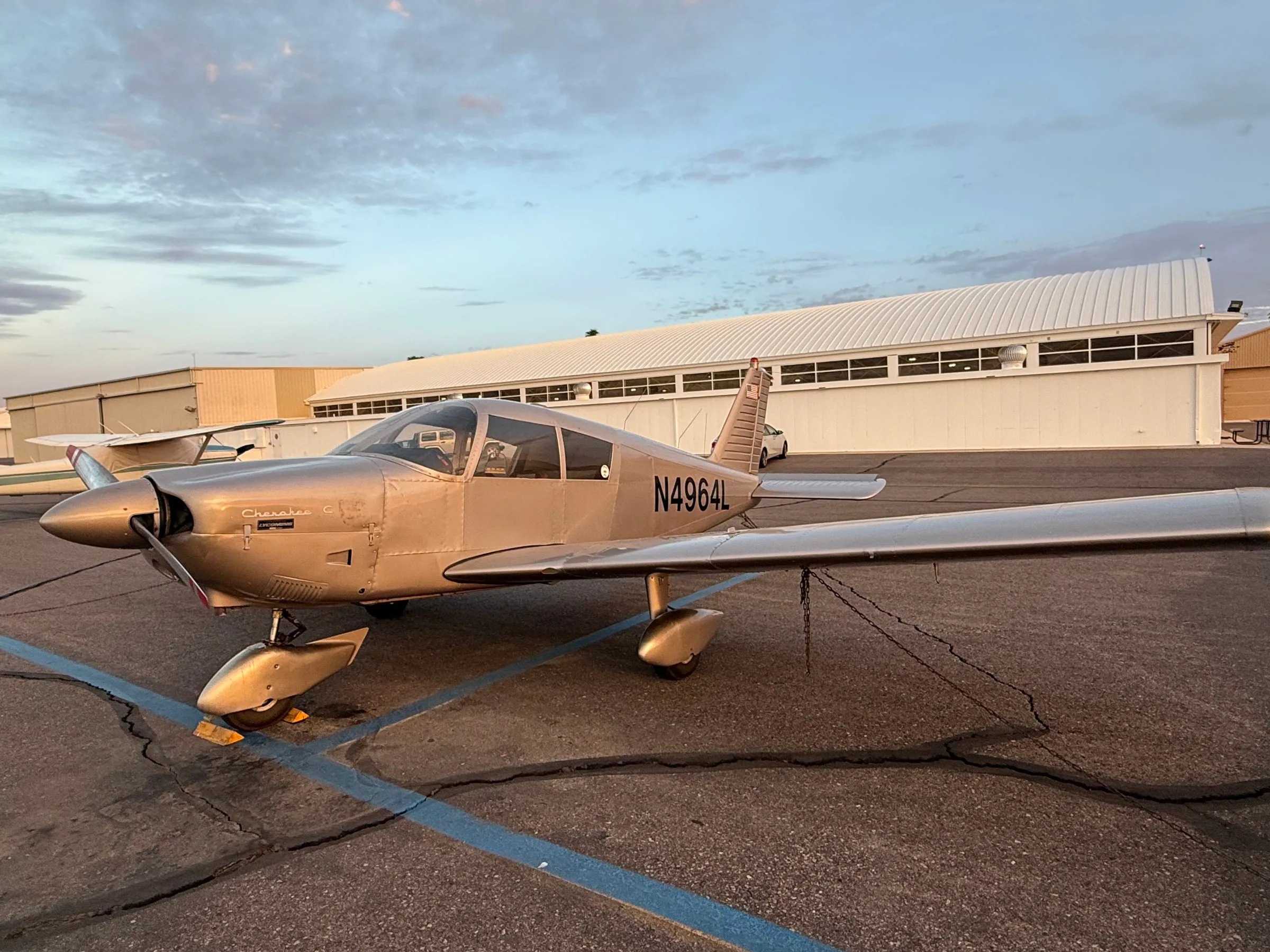 Exterior view of a 1967 Piper PA-28-180 Cherokee, N4964L.