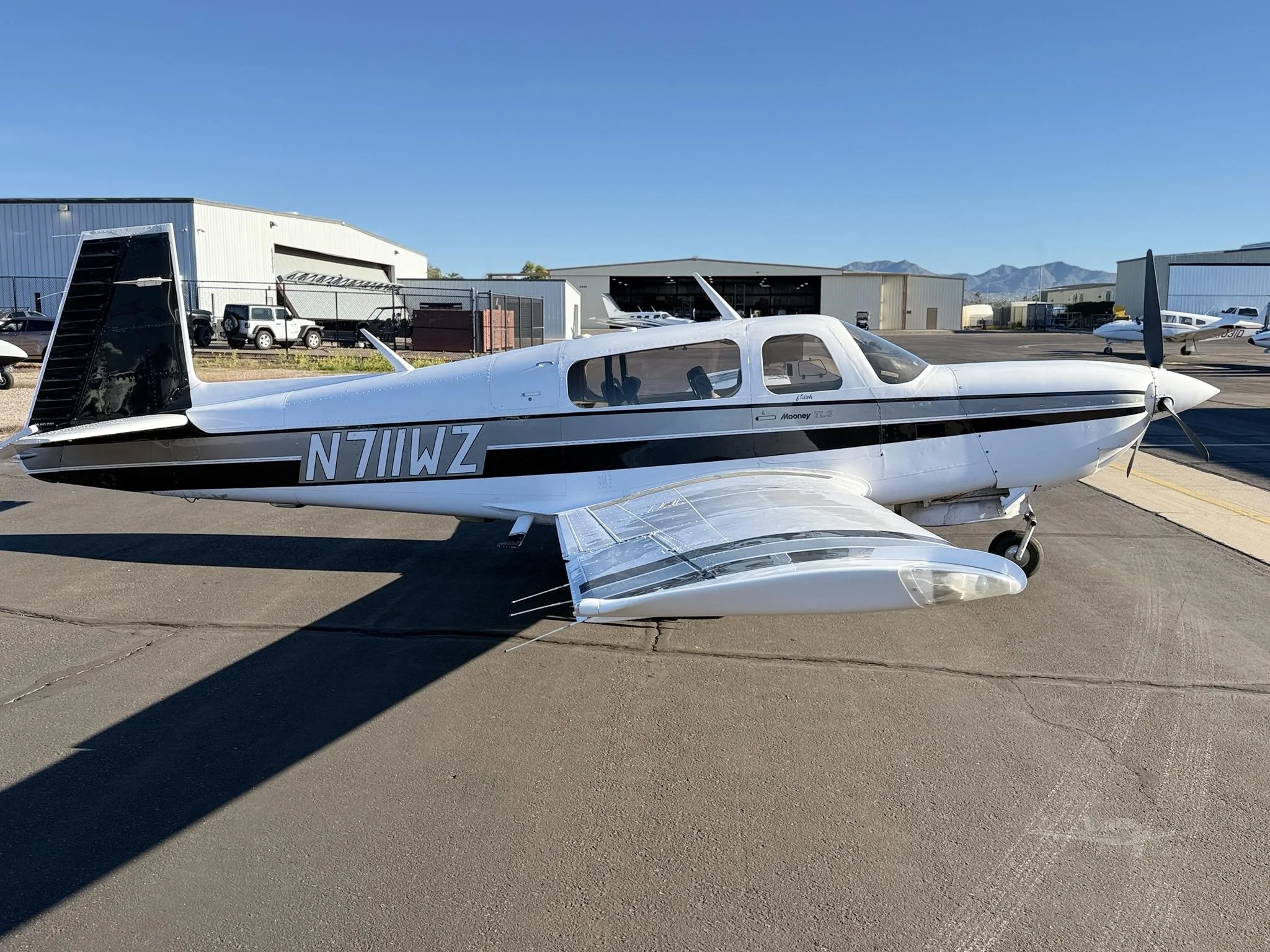 Exterior view of a 1990 MOONEY M20M TLS, N711WZ.