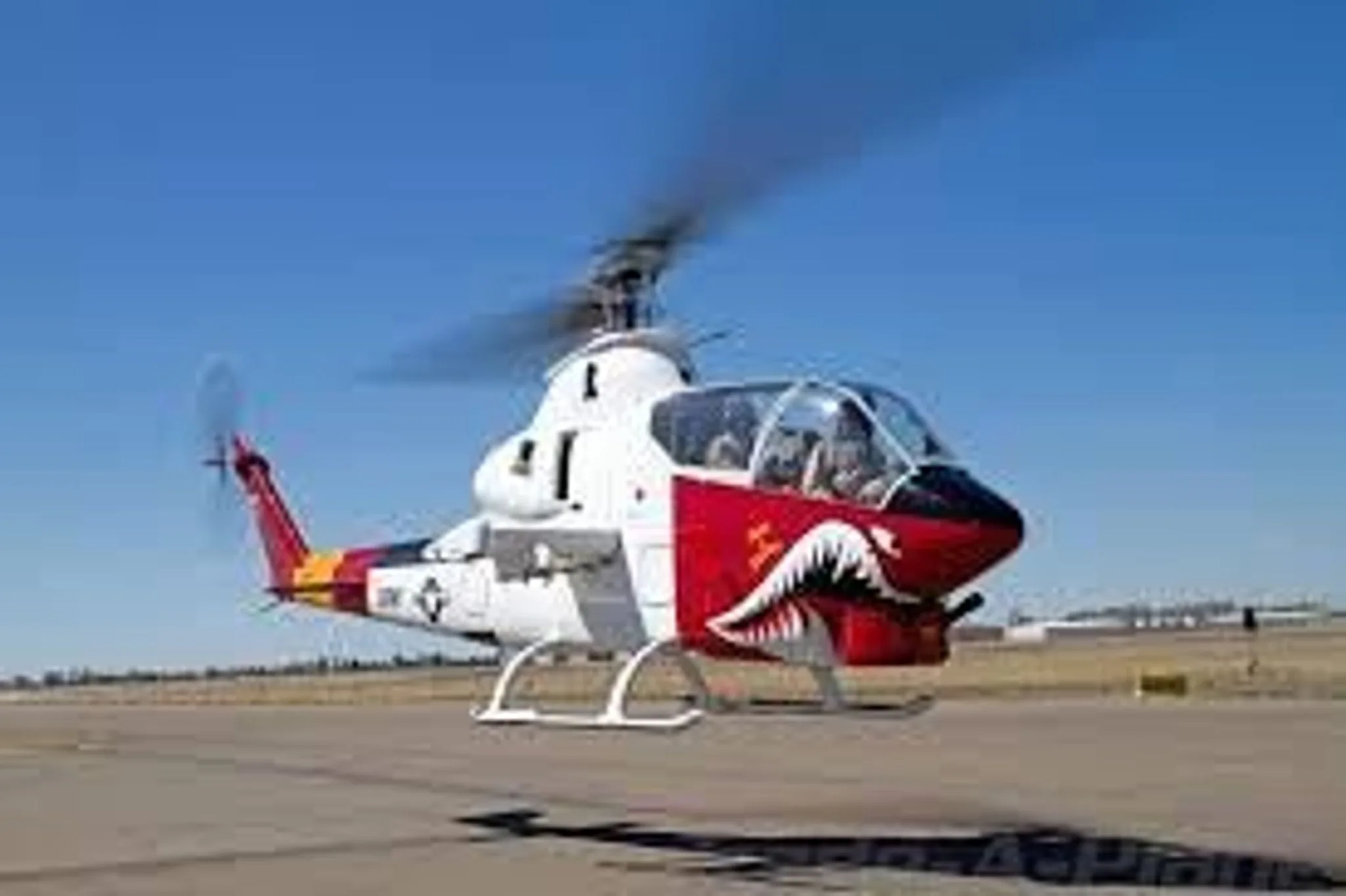 Exterior view of a BELL 209 AH-1 COBRA, N102JG.
