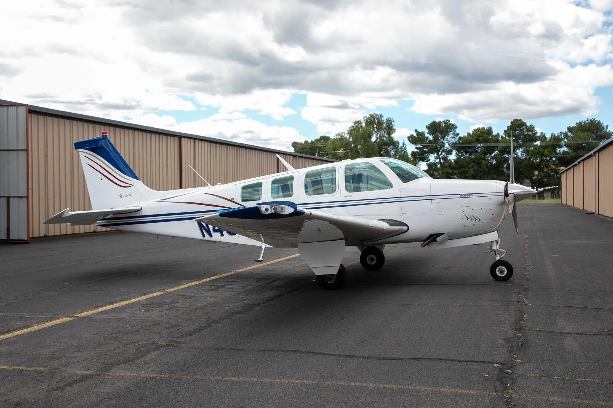 Exterior view of a 1976 BEECHCRAFT A36 BONANZA, N40JH.