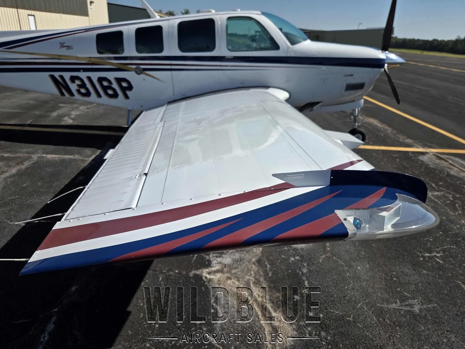 Exterior view of a 1999 BEECHCRAFT A36 BONANZA, N316P.