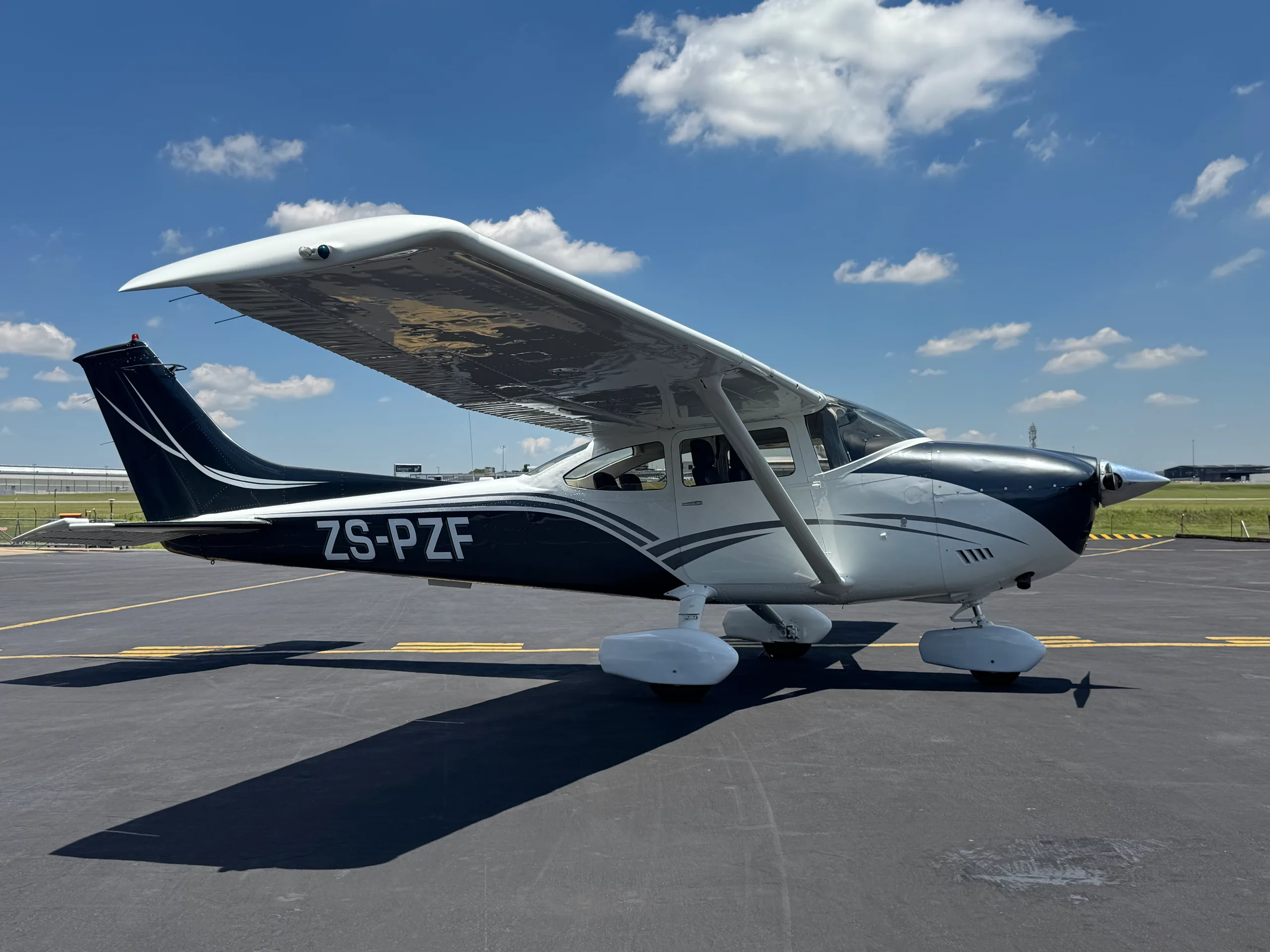 Exterior view of a 1973 Cessna 182L, ZS-PZF.
