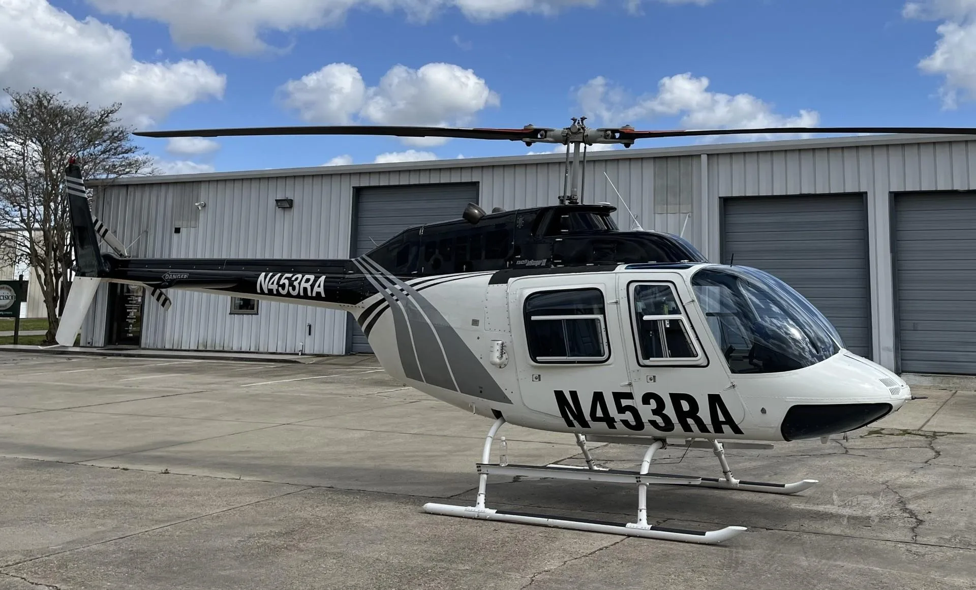 Exterior view of a 1981 BELL 206B III, N453RA.