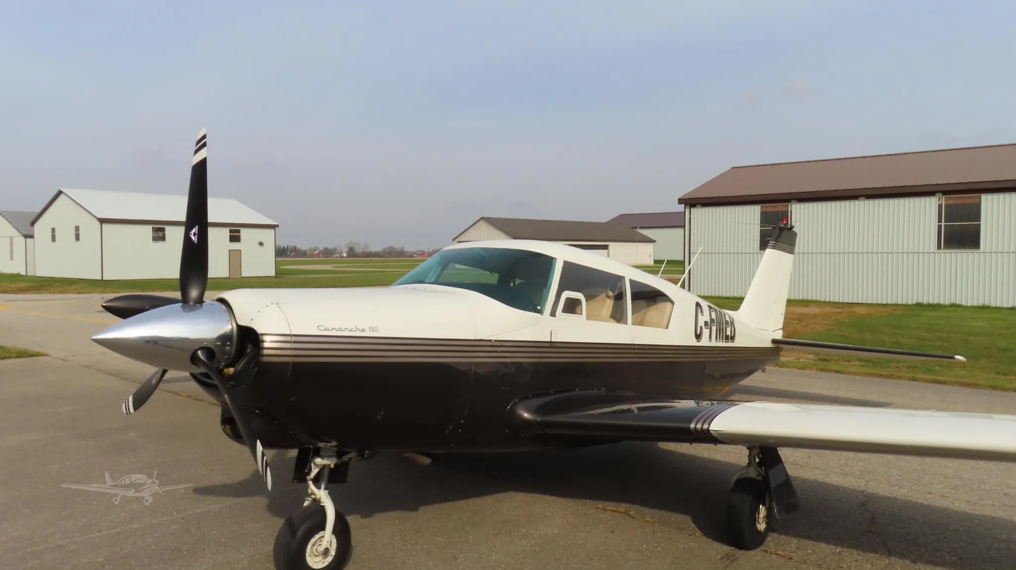 Exterior view of a 1960 PIPER COMANCHE 180, C-FMEB.
