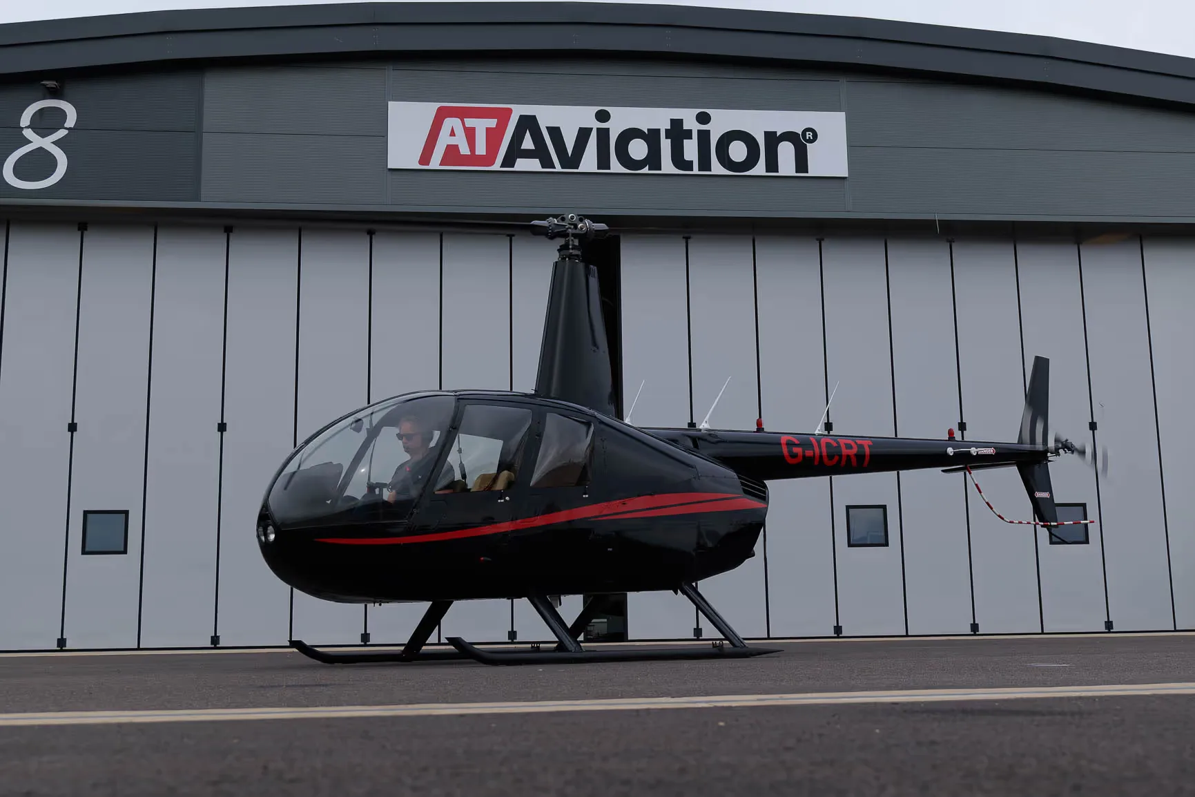 Exterior view of a 2007 Robinson R44 Raven II, G-ICRT.