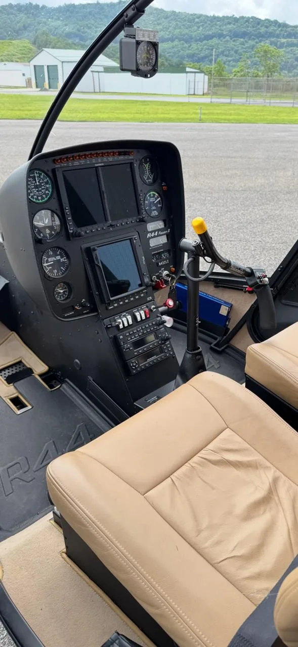 Cockpit and instrument panel of a 2017 ROBINSON R44 RAVEN II.