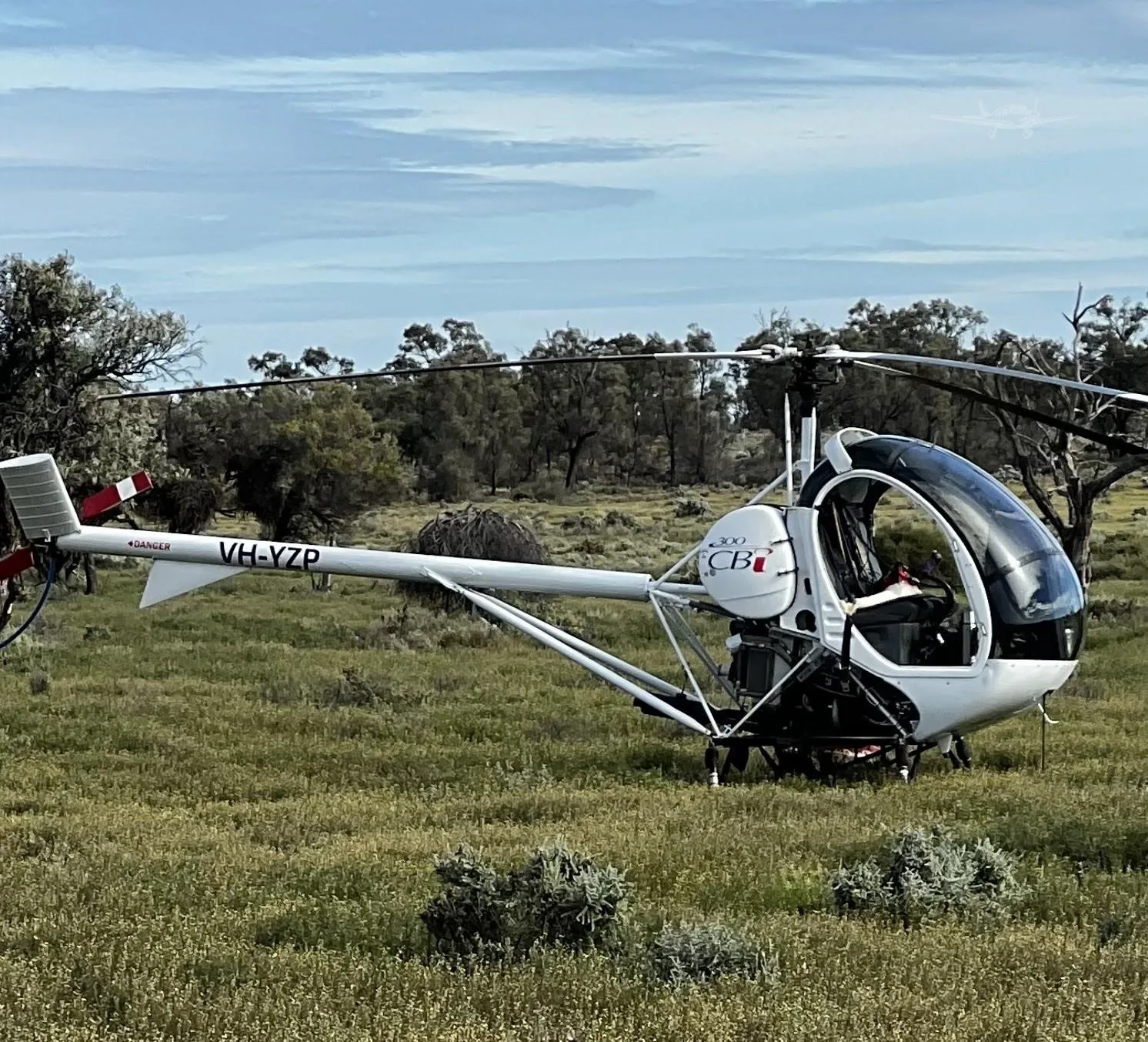 Exterior view of a 2006 SCHWEIZER 269C-1, VH-YZP.