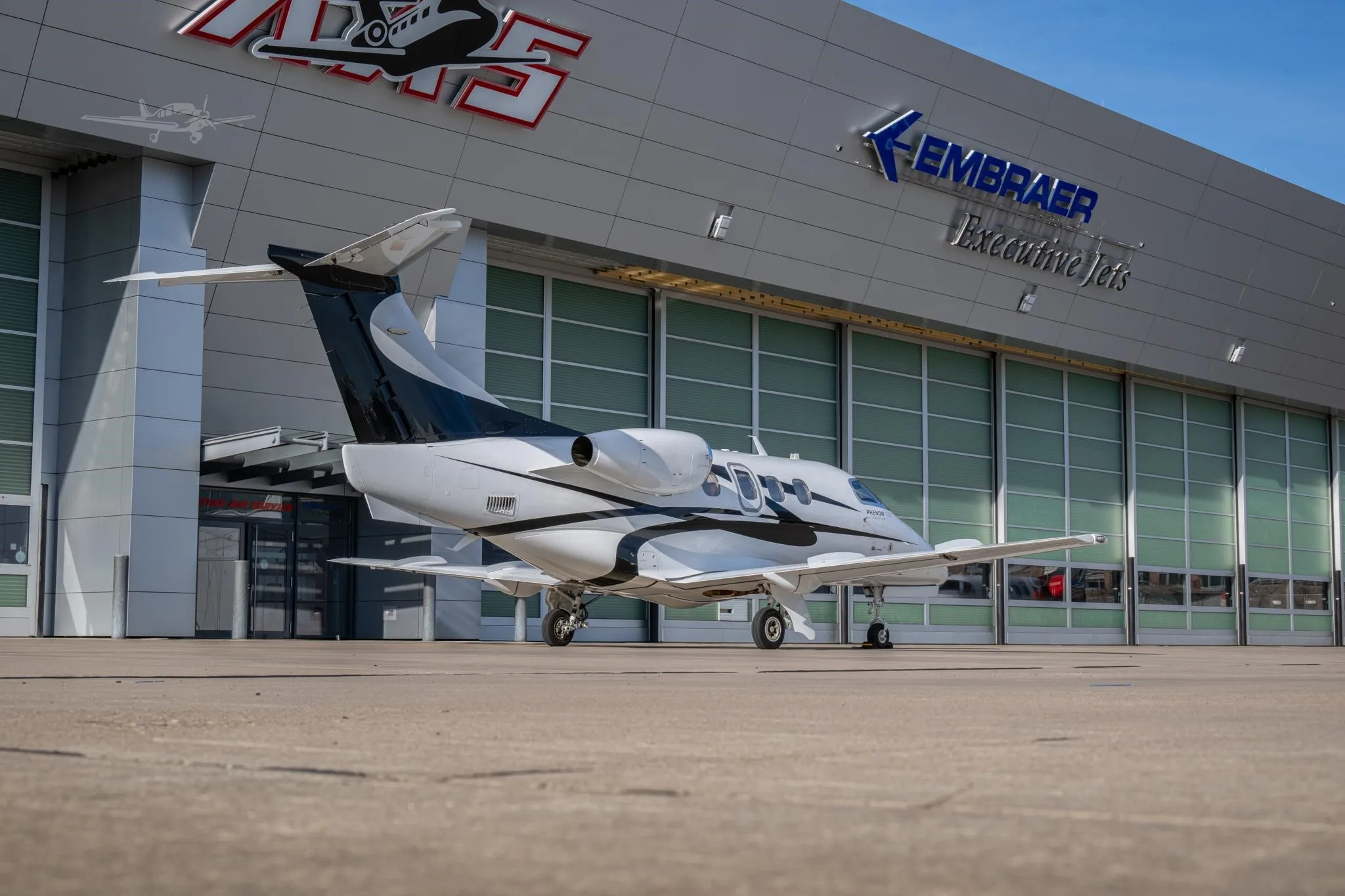 Exterior view of a 2015 EMBRAER PHENOM 100E.