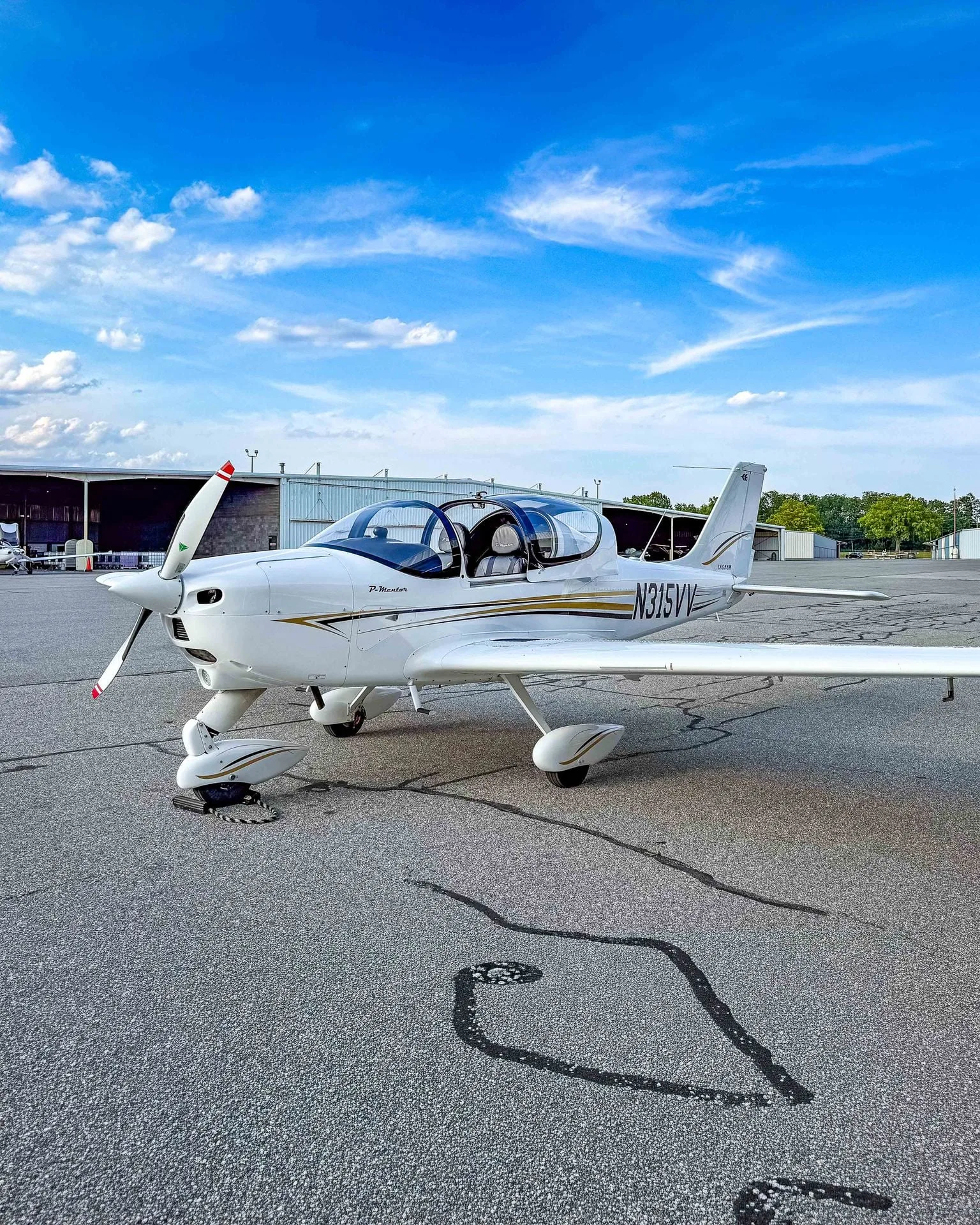 Exterior view of a 2024 Tecnam P-Mentor, N315VV.