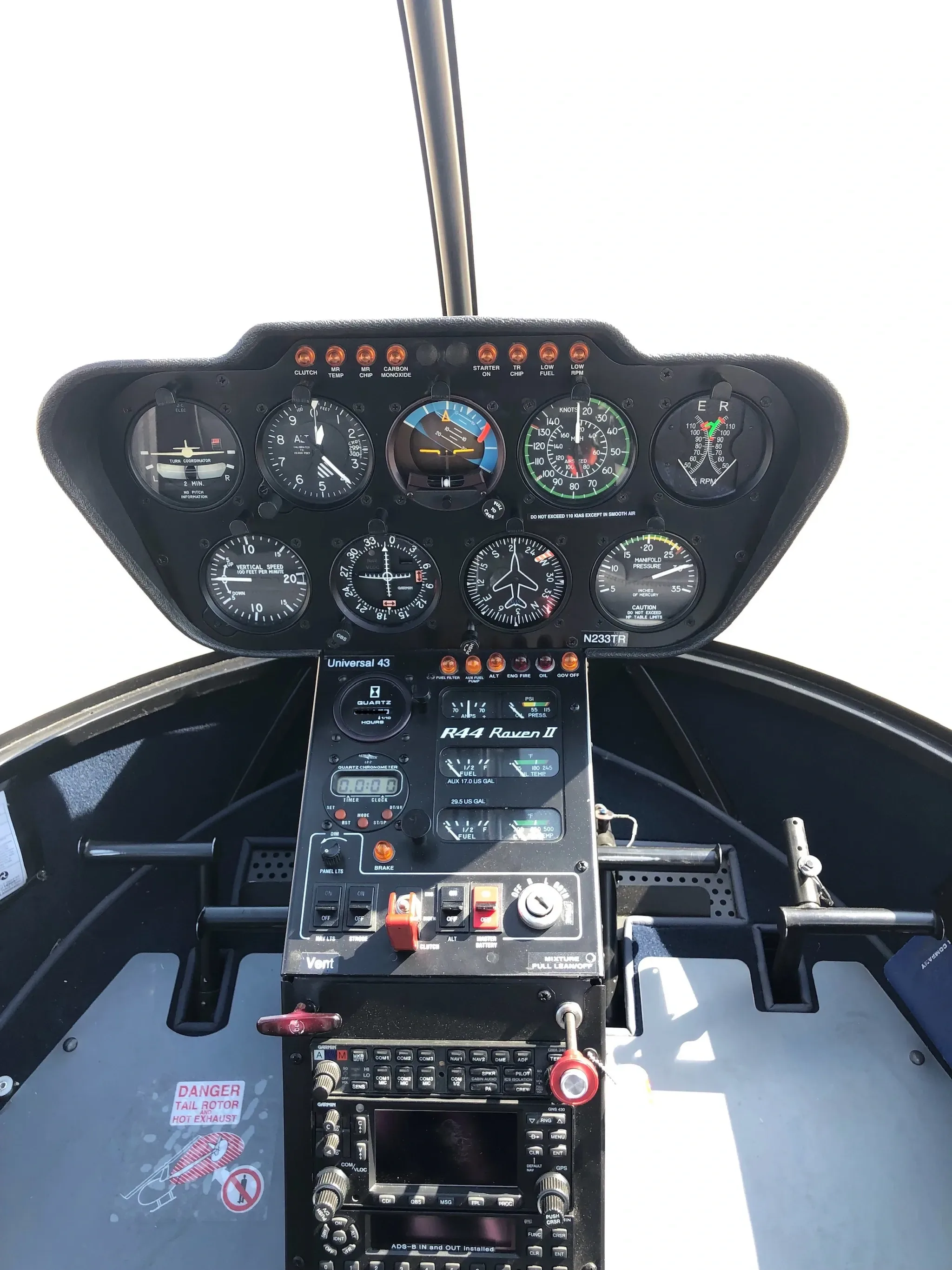 Cockpit and instrument panel of a 2003 Robinson R44 II.
