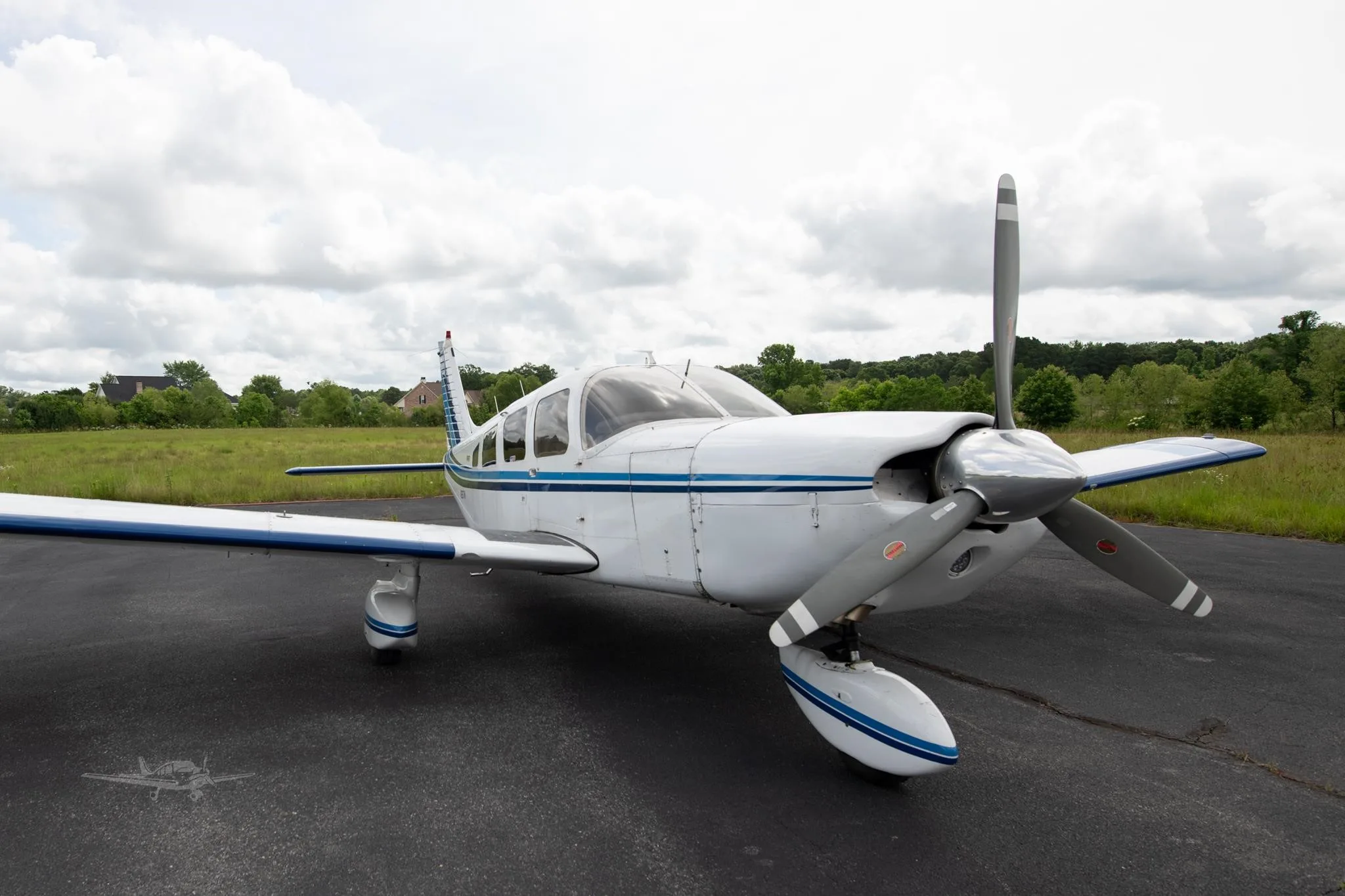 Exterior view of a 1977 PIPER CHEROKEE 6/300, N2617M.