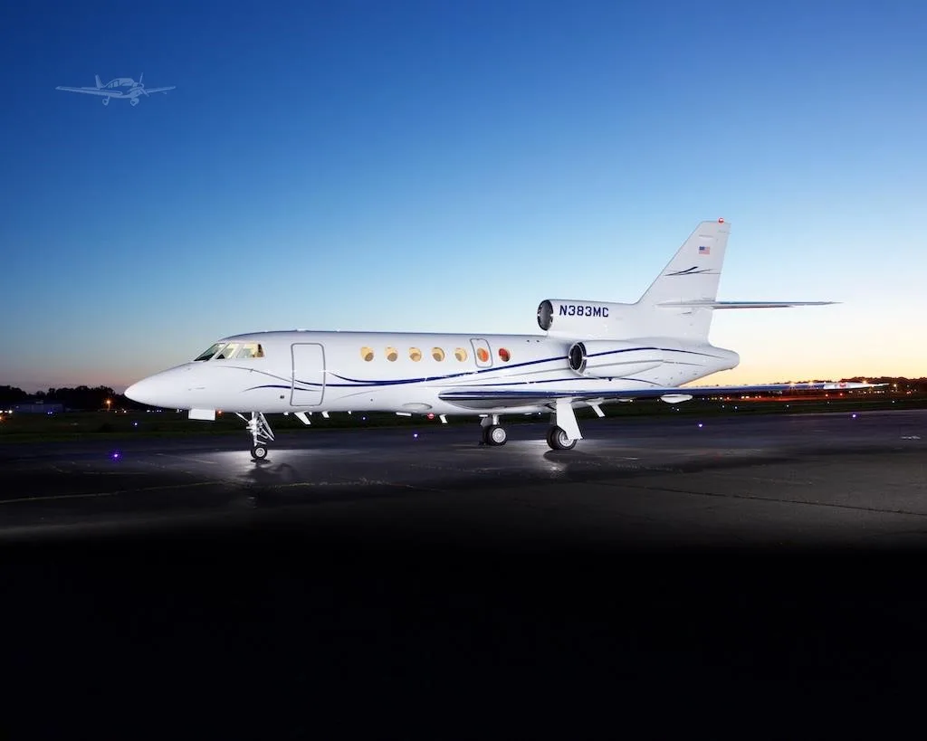 Exterior view of a 2002 DASSAULT FALCON 50EX, N383MC.