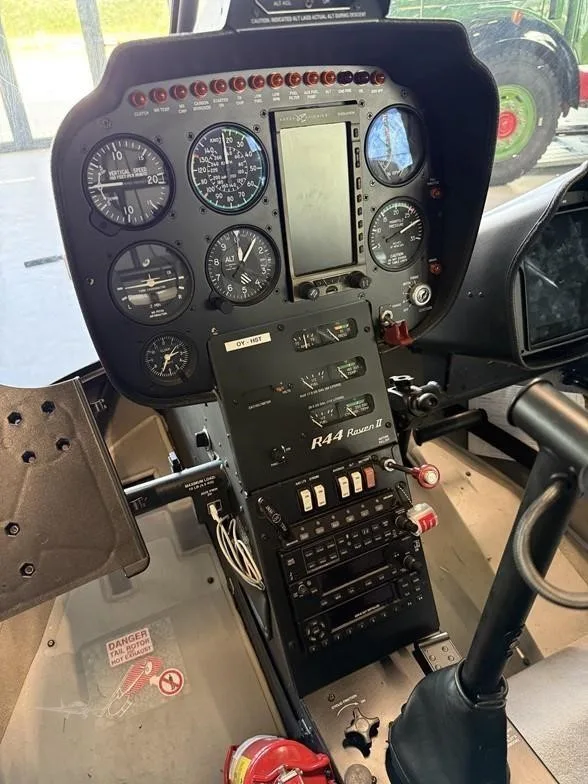 Cockpit and instrument panel of a 2017 ROBINSON R44 RAVEN II.