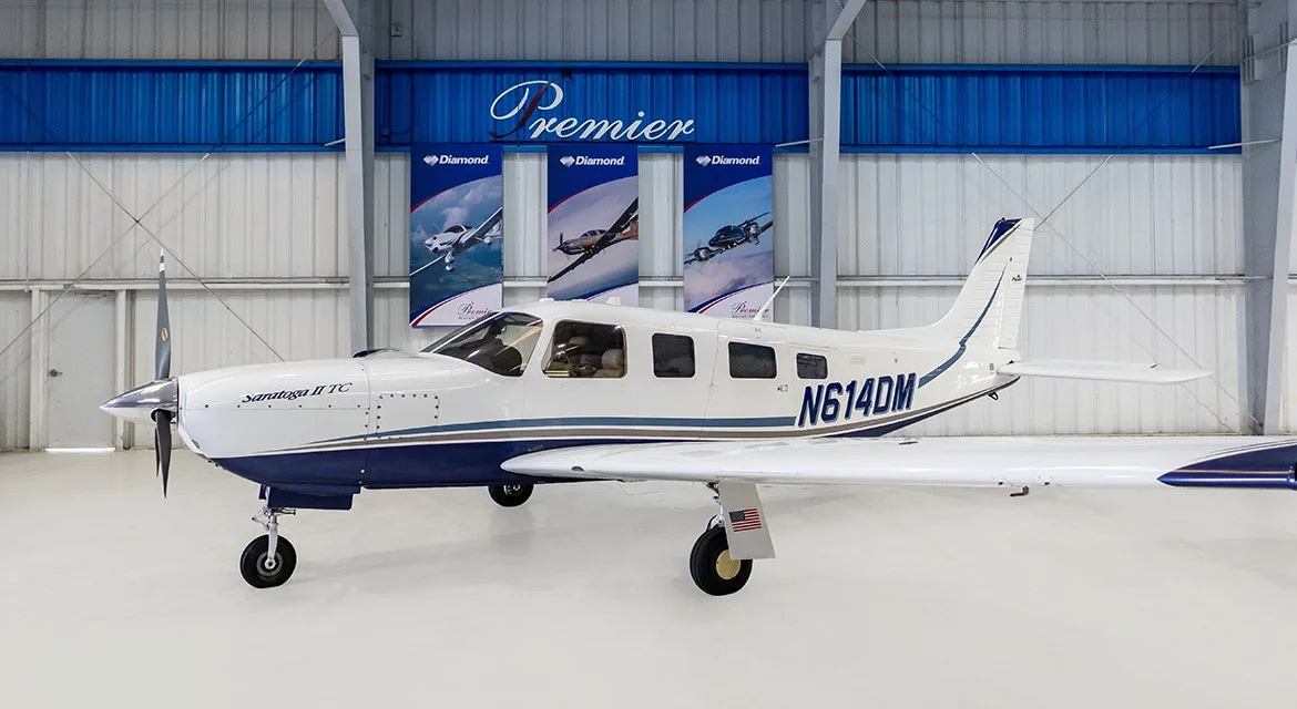Exterior view of a 2006 Piper Saratoga II TC, N614DM.