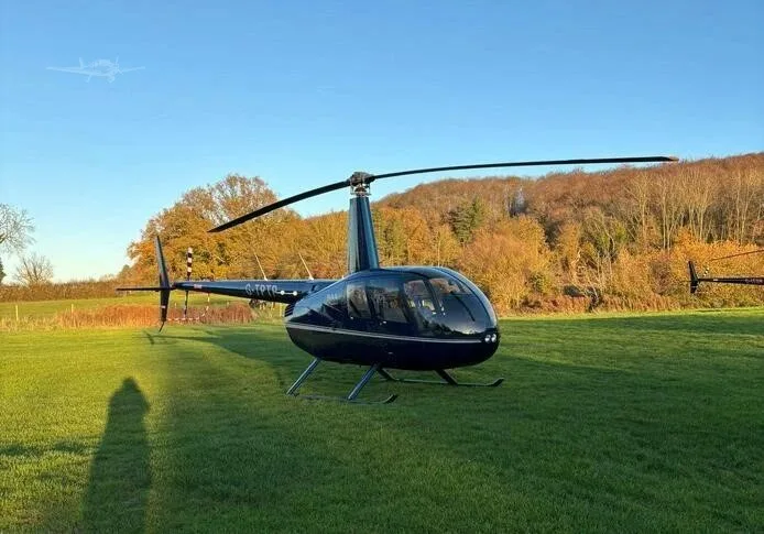Exterior view of a 2010 ROBINSON R44 RAVEN I, G-TPTP.
