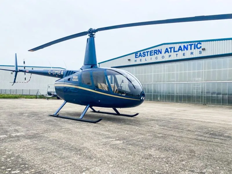 Exterior view of a 2011 Robinson R66, G-CMEA.