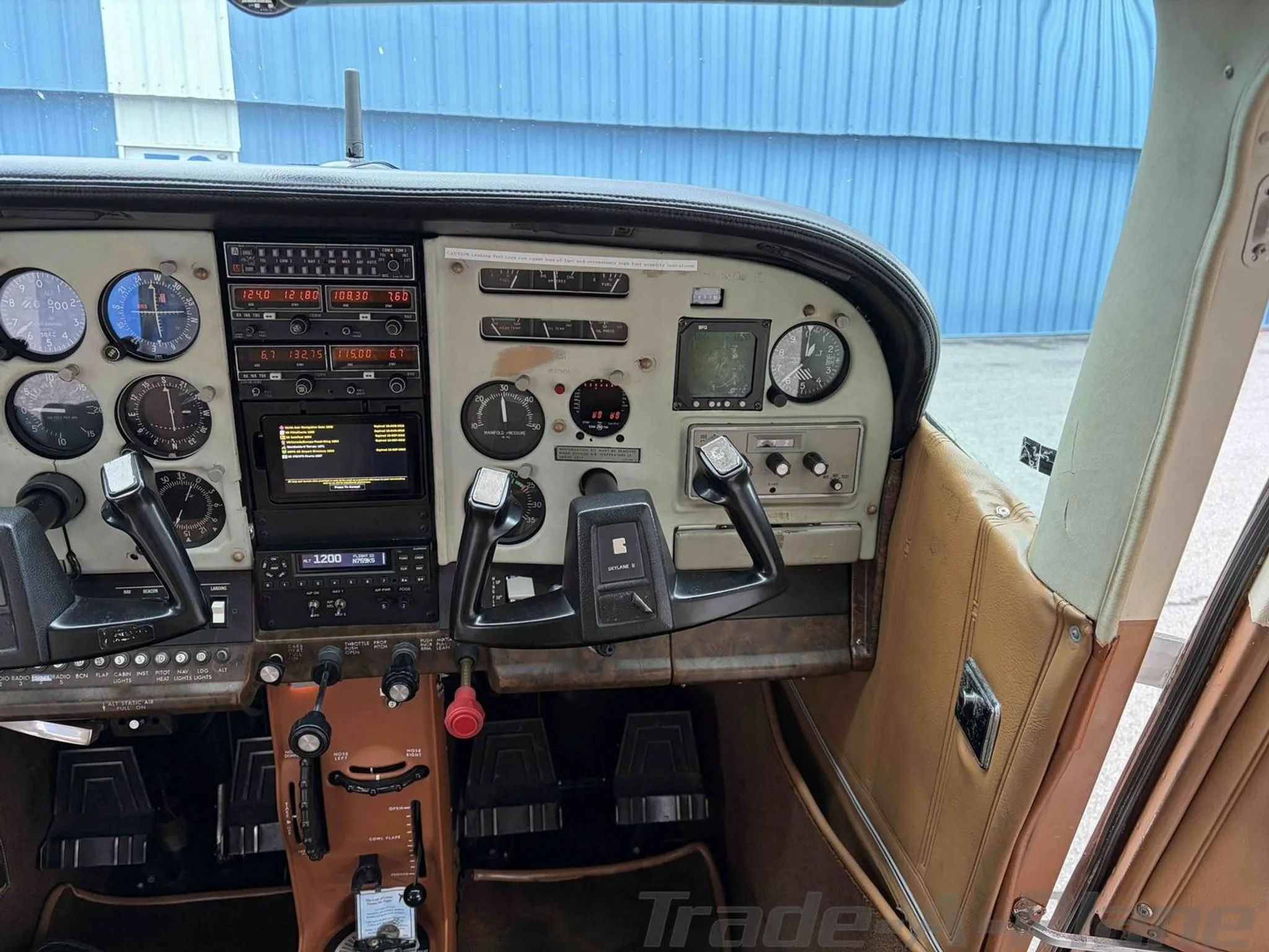 Cockpit and instrument panel of a 1977 CESSNA 182Q SKYLANE.