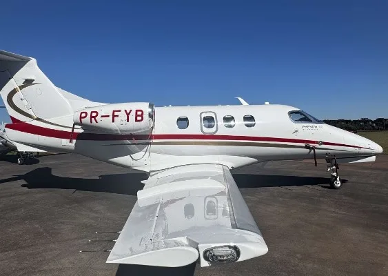 Marketing image of a 2013 Embraer Phenom 100.