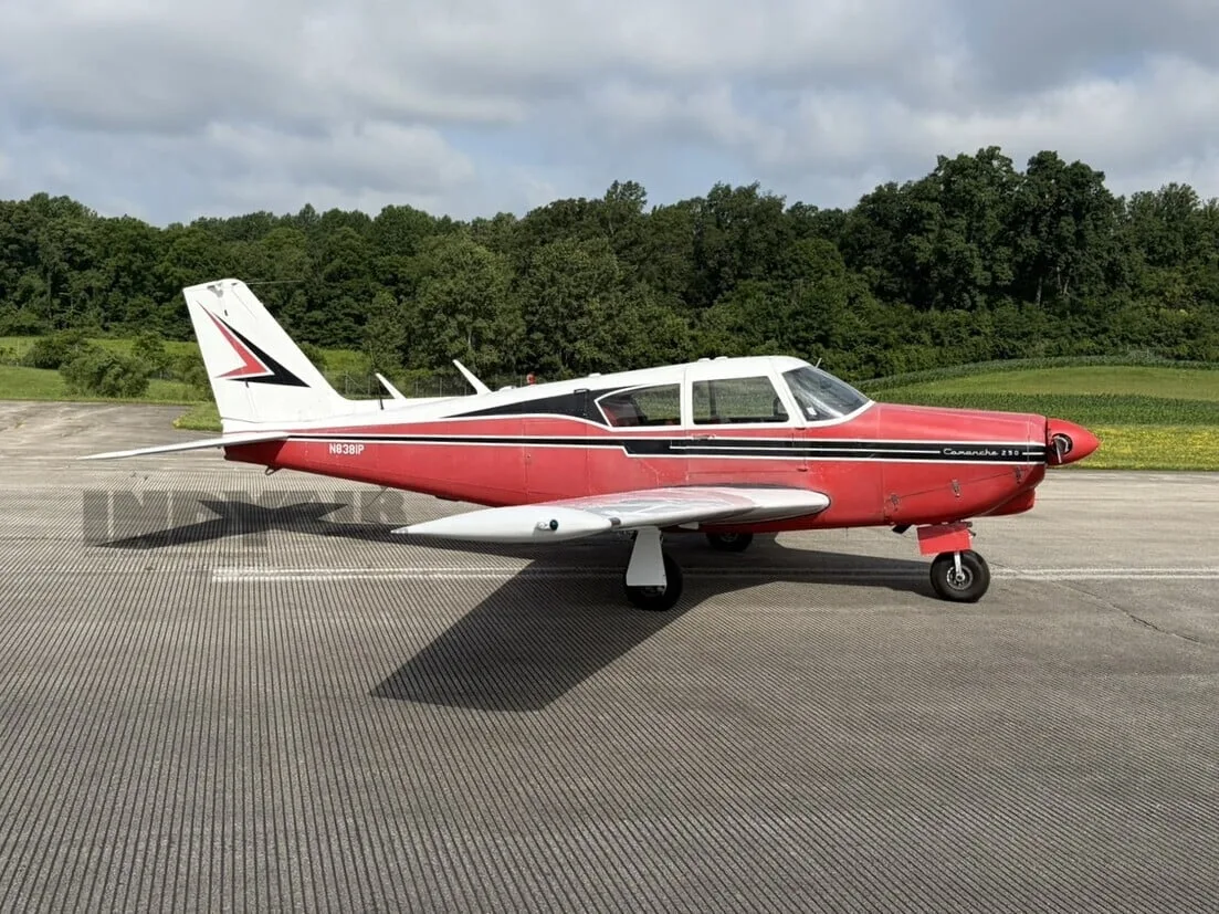 Exterior view of a Piper Comanche 250, N8381P.