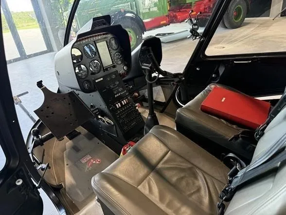 Cockpit and instrument panel of a 2017 ROBINSON R44 RAVEN II.