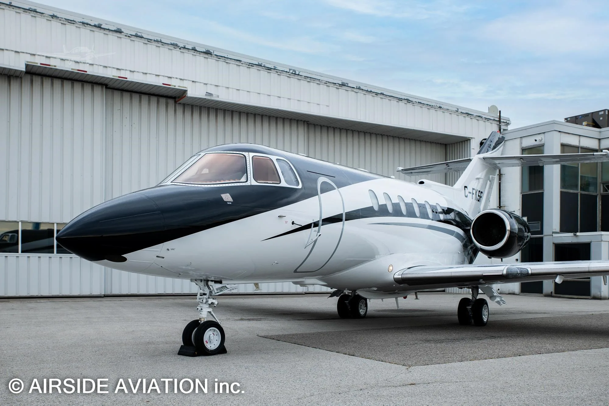Exterior view of a 2003 HAWKER 800XP, C-FKSF.