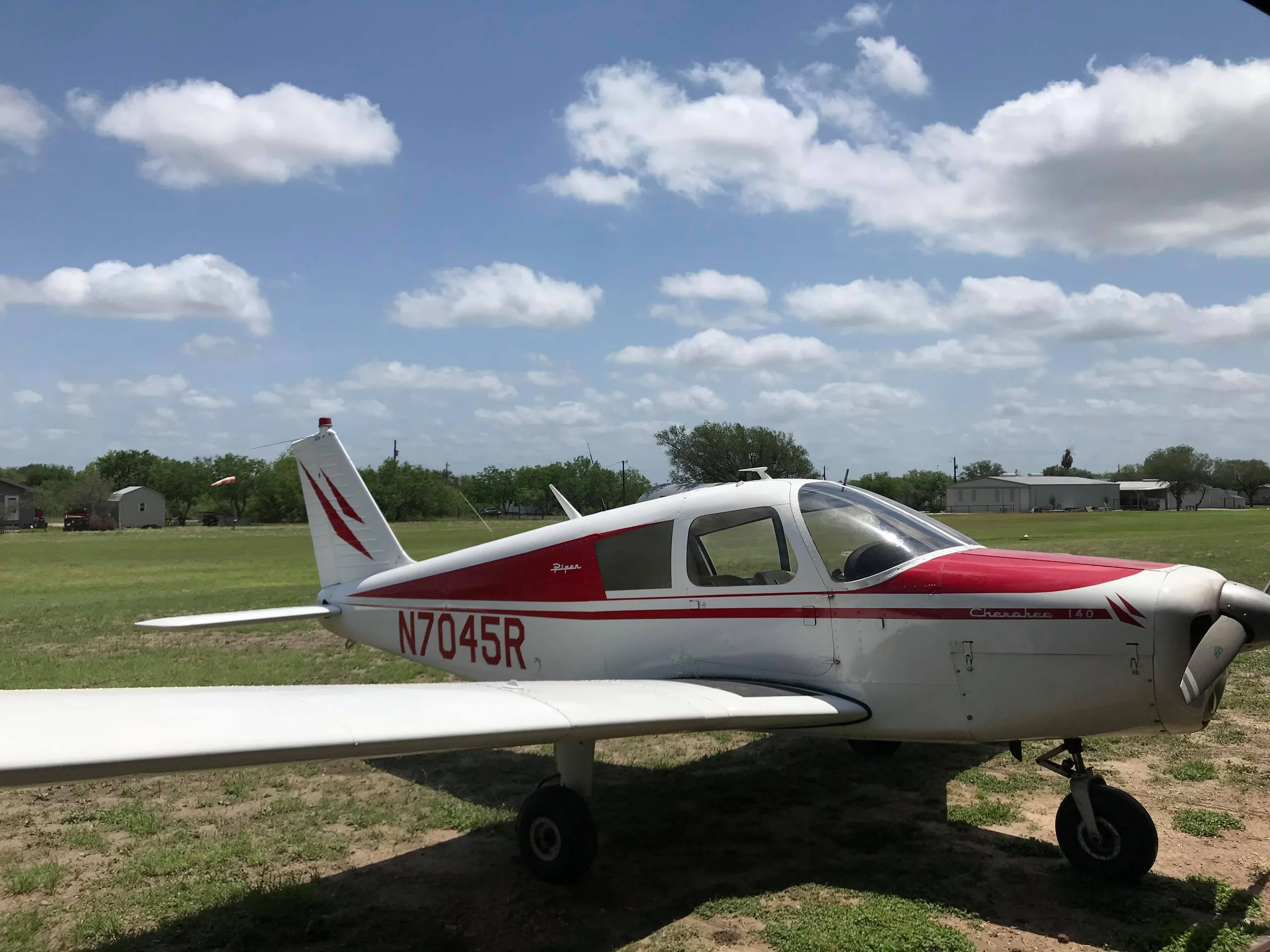 Exterior view of a 1966 Piper Cherokee 28-21742, N7045R.
