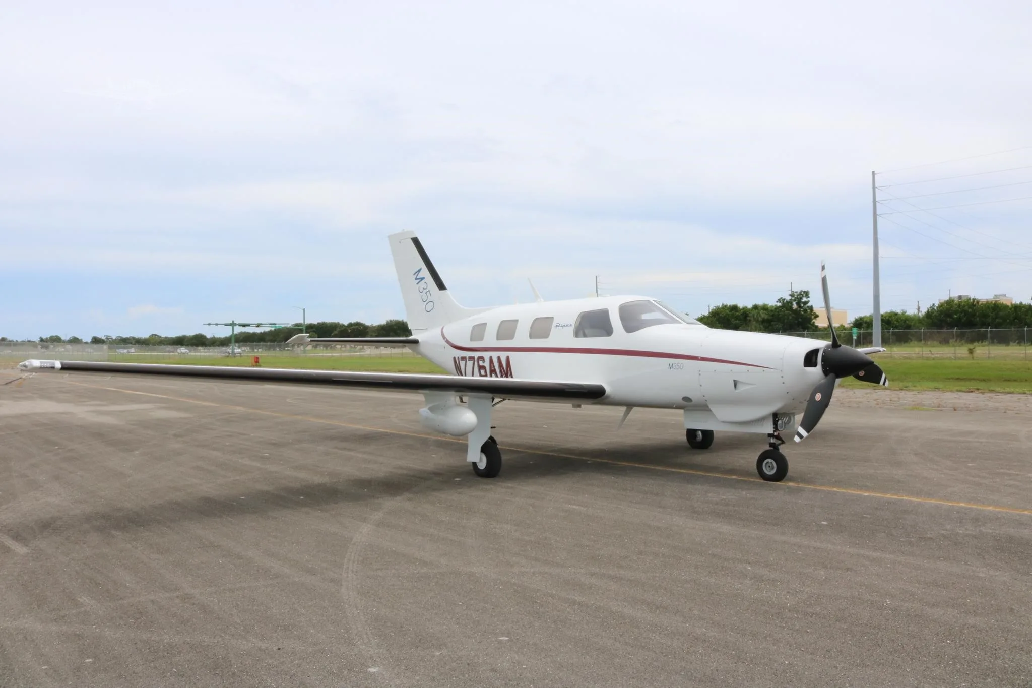 Exterior view of a 2026 PIPER M350, N776AM.