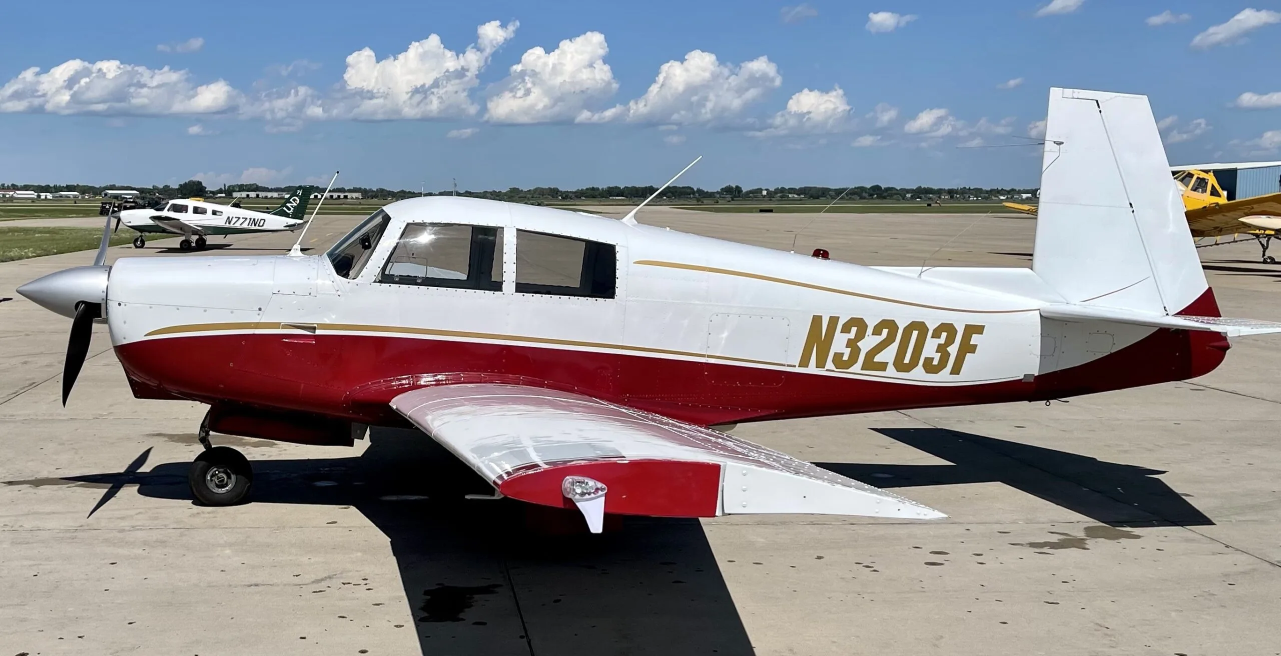 Exterior view of a 1967 Mooney M20C, N3203F.