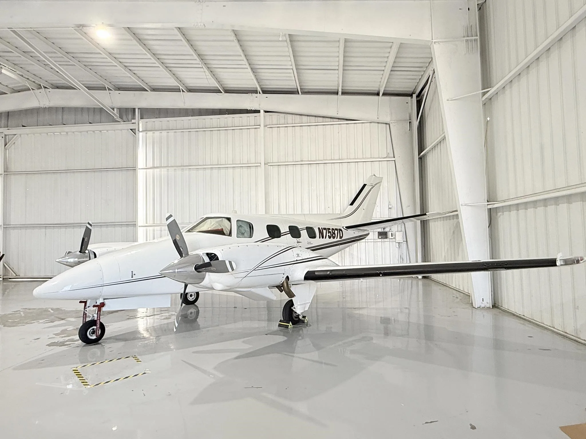 Exterior view of a 1971 BEECHCRAFT A60 DUKE, N7587D.