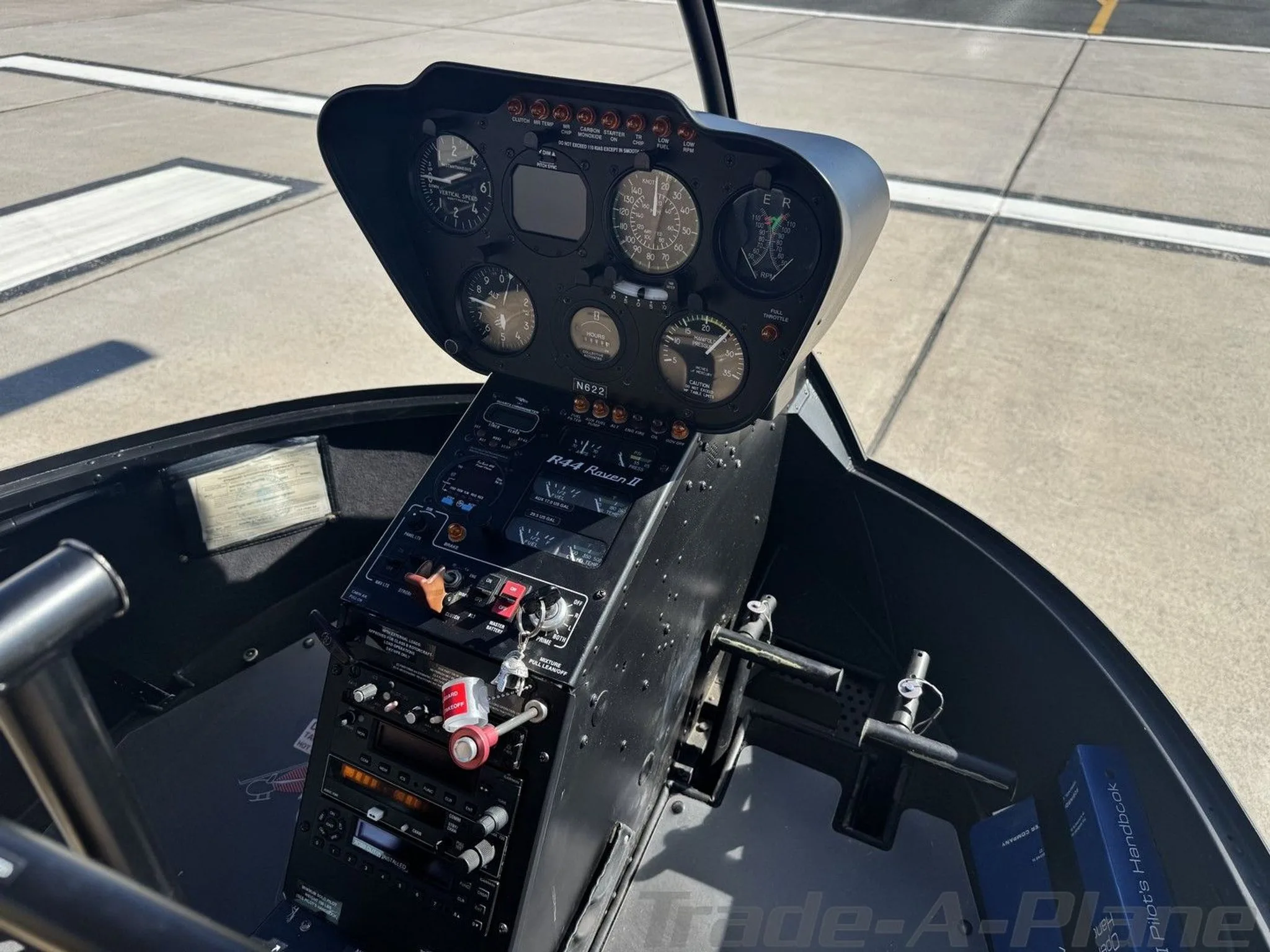 Cockpit and instrument panel of a 2002 ROBINSON R44 RAVEN II.